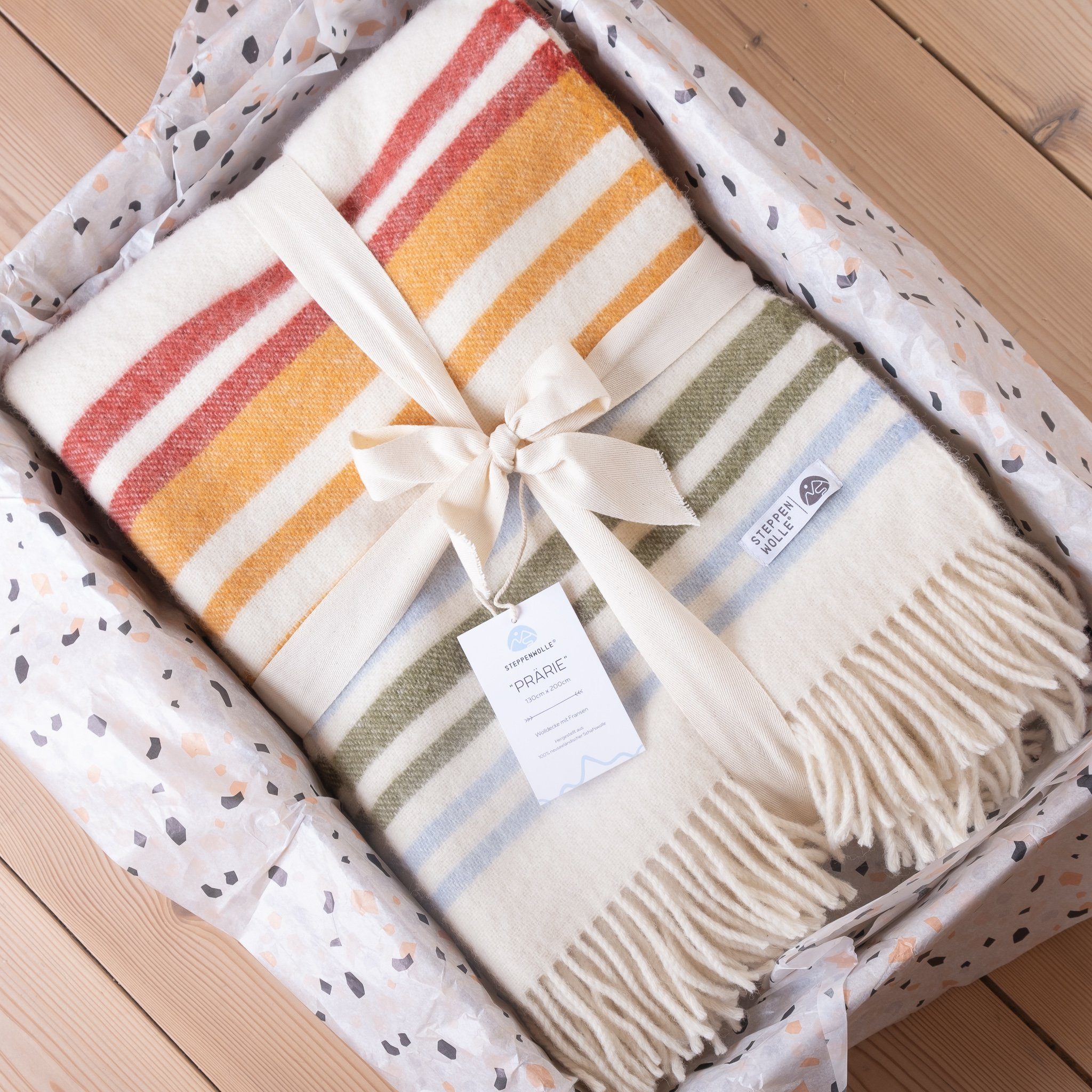 Plaid PRÄRIE, Steppenwolle, Nachhaltige Wolldecke bunt günstig online kaufen