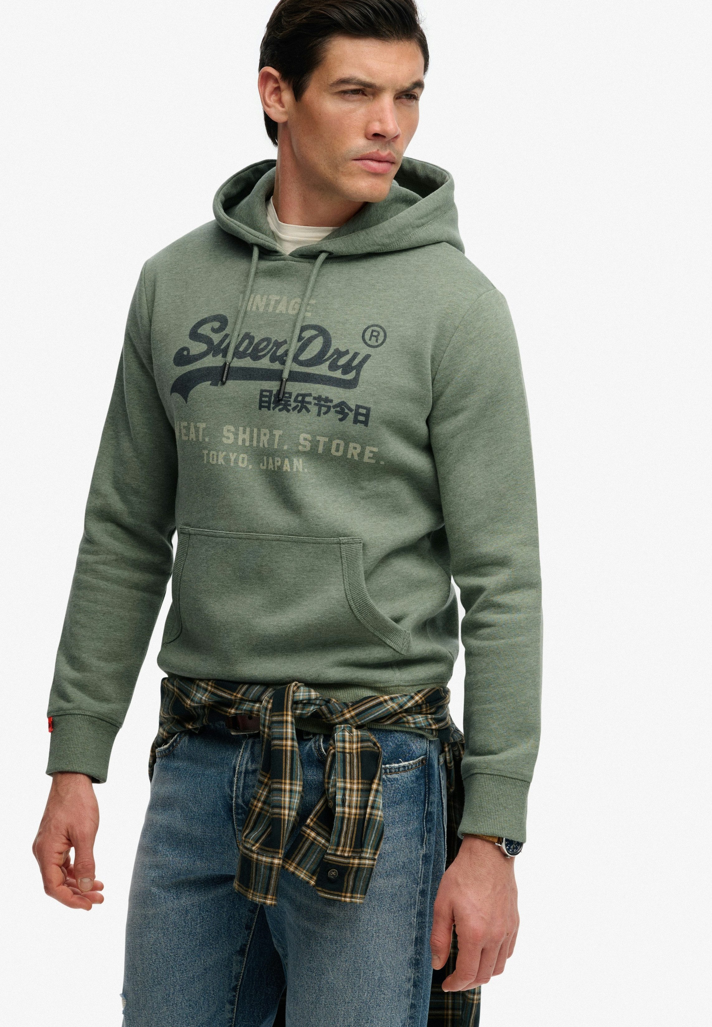 Superdry Kapuzensweatshirt SD-VL HERITAGE RELAXED HOOD aus Baumwollmischung, Relaxed Fit, mit Rippbündchen am Rumpfabschluss