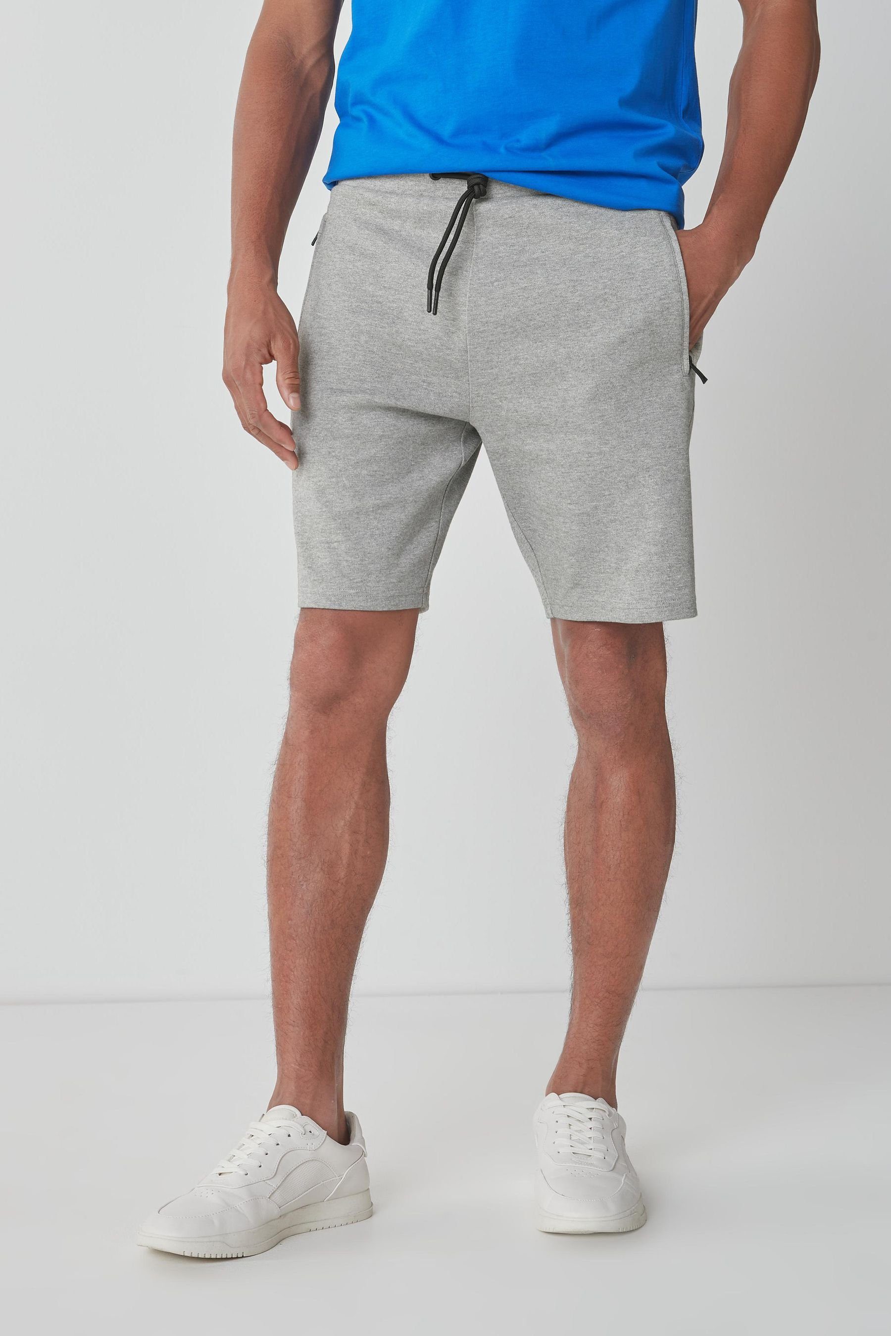 Next Sweatshorts Jersey-Shorts mit Reißverschlusstaschen-Slim Fit (1-tlg) Light Grey