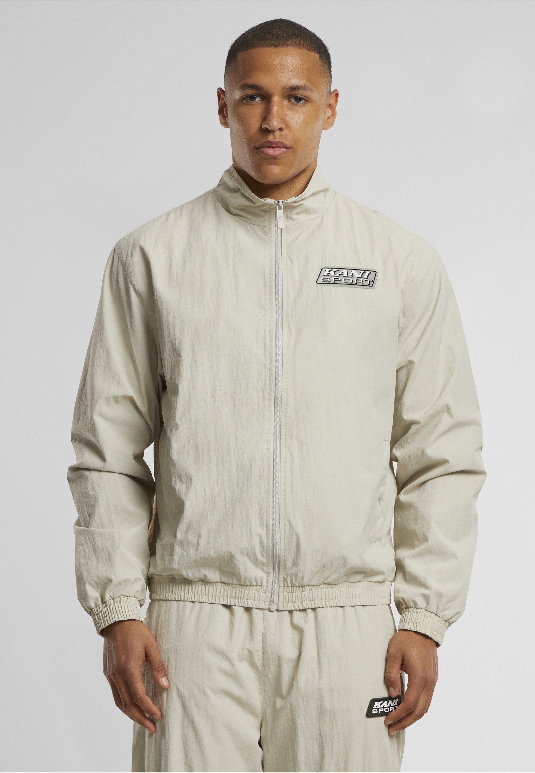 Karl Kani Trainingsjacke Karl Kani Sport Patch Essential Trackjacket (1-St)