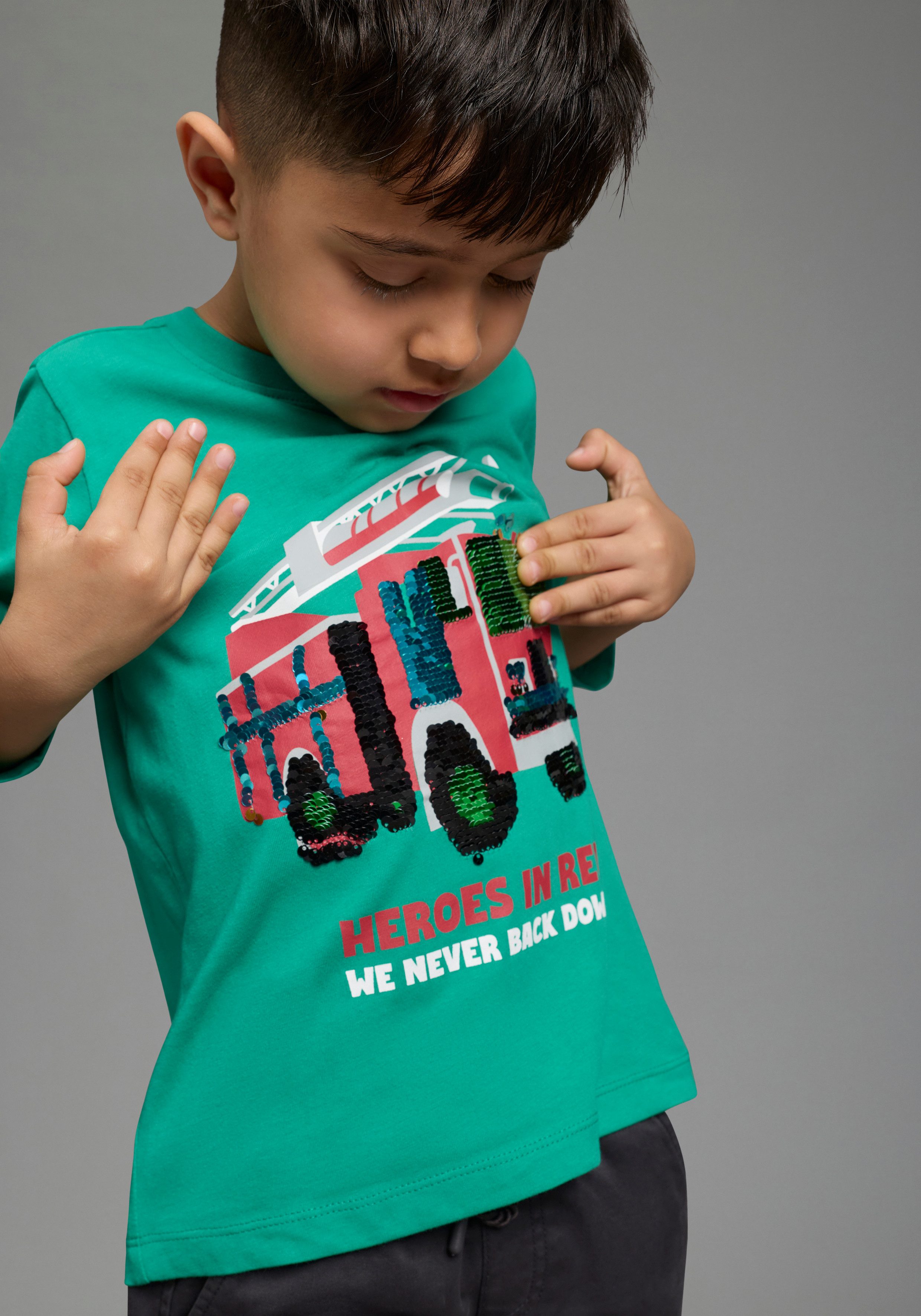 KIDSWORLD Langarmshirt Feuerwehr Pailletten Shirt Feuerwehr Druck mit Pailletten