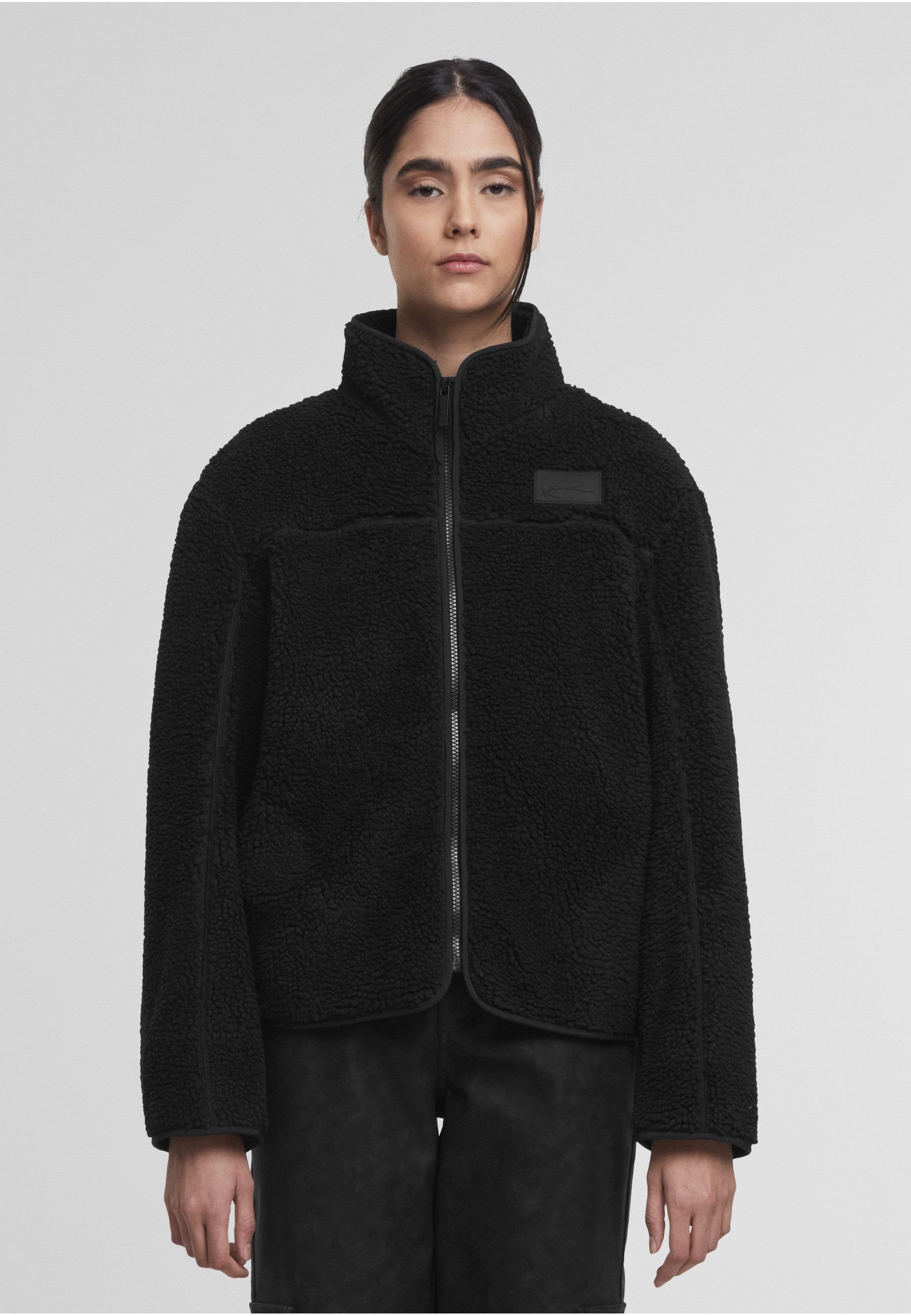 Karl Kani Trainingsjacke Karl Kani Signature Teddy Trackjacket (1-St)