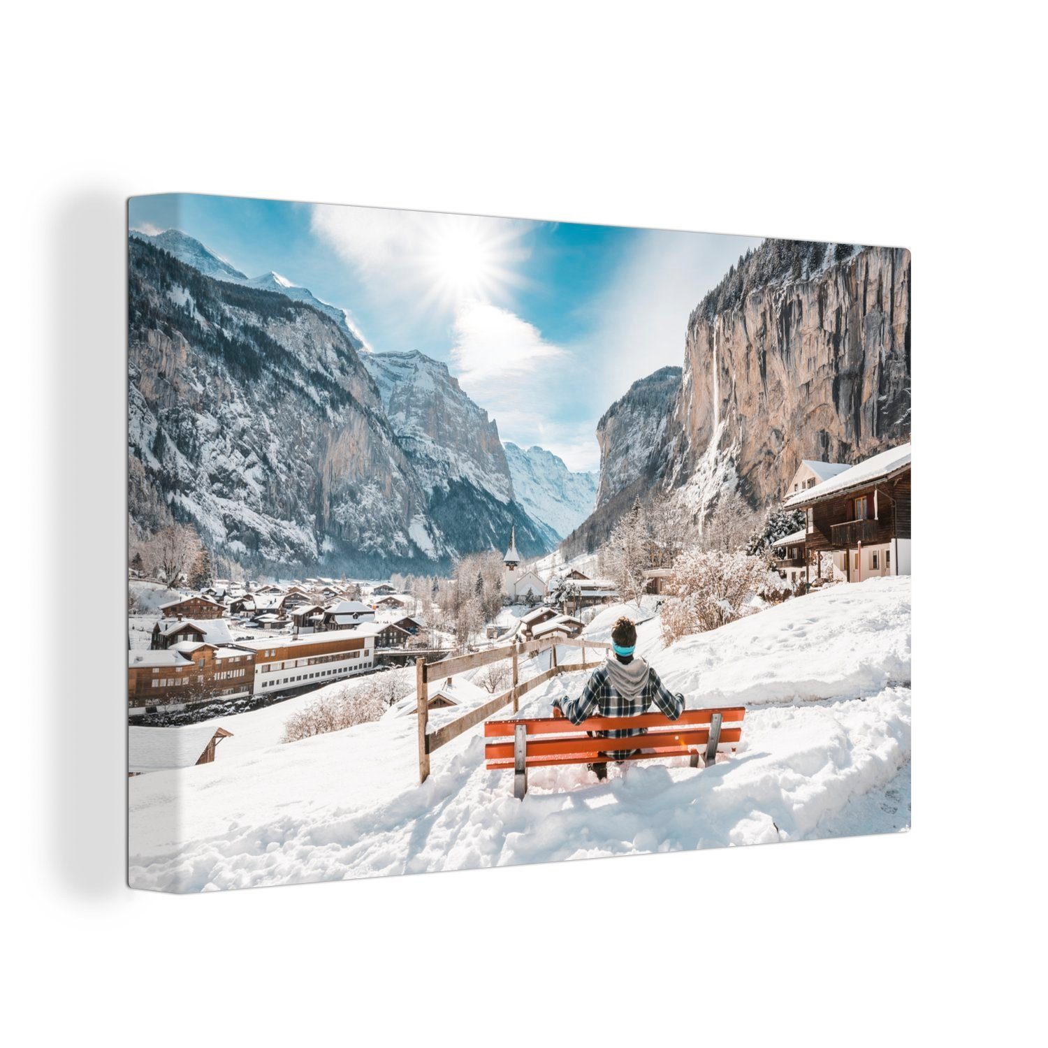 OneMillionCanvasses® Leinwandbild Mann auf einer Bank im Winter in der Schweiz, (1 St), Wandbild Leinwandbilder, Aufhängefertig, Wanddeko, 30x20 cm