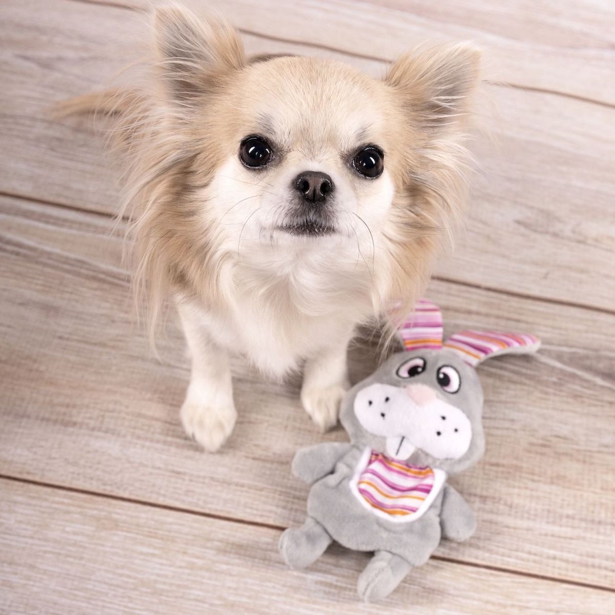 Flamingo Tierkuscheltier Hundespielzeug Pieno Kaninchen mit Latz grau