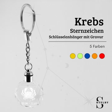 Stelby Schlüsselanhänger Krebs Sternzeichen Schlüsselanhänger LED Multicolor mit Geschenkbox