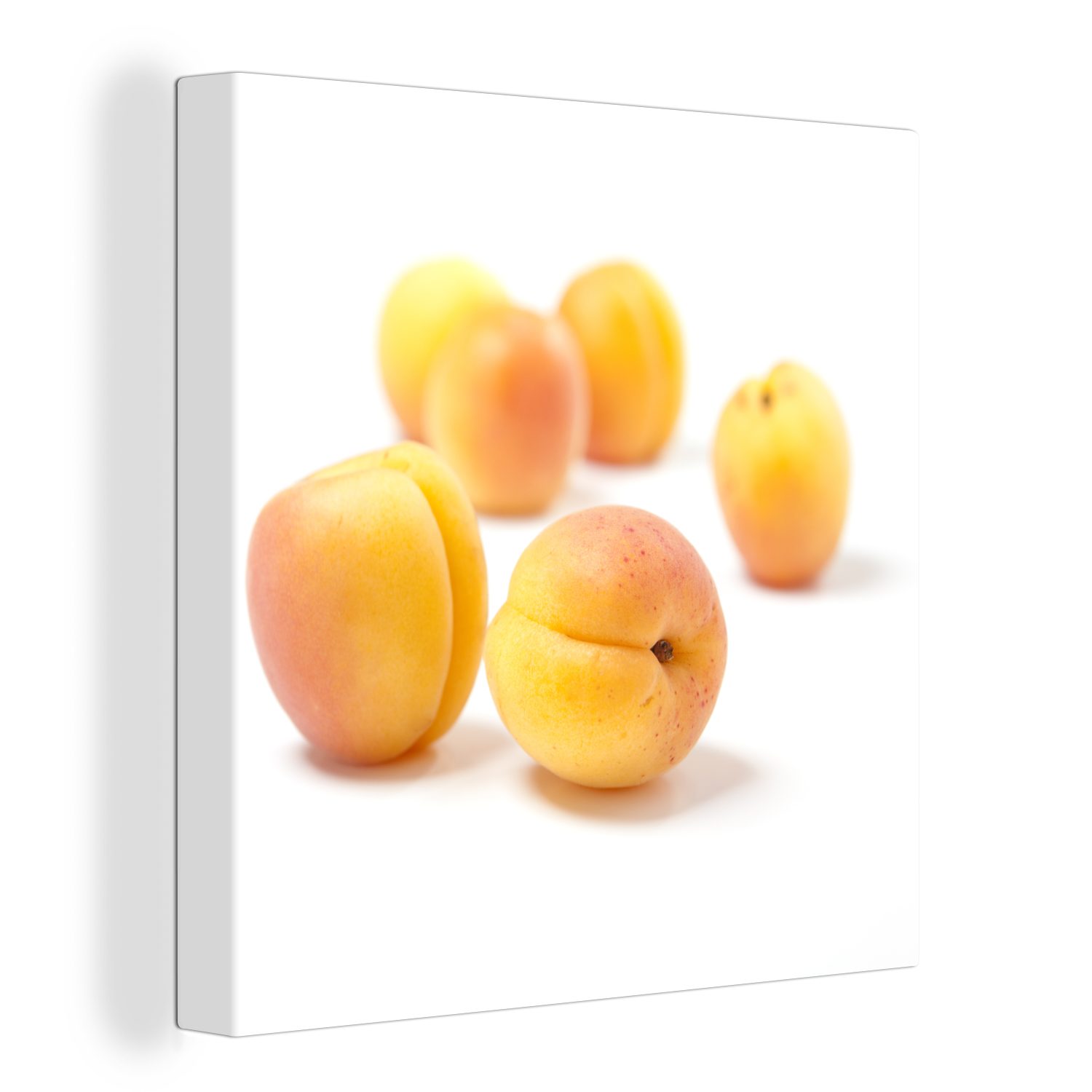 OneMillionCanvasses® Leinwandbild Runde Aprikosen mit orangefarbenen Schattierungen auf weißem, (1 St), Leinwand Bilder für Wohnzimmer Schlafzimmer