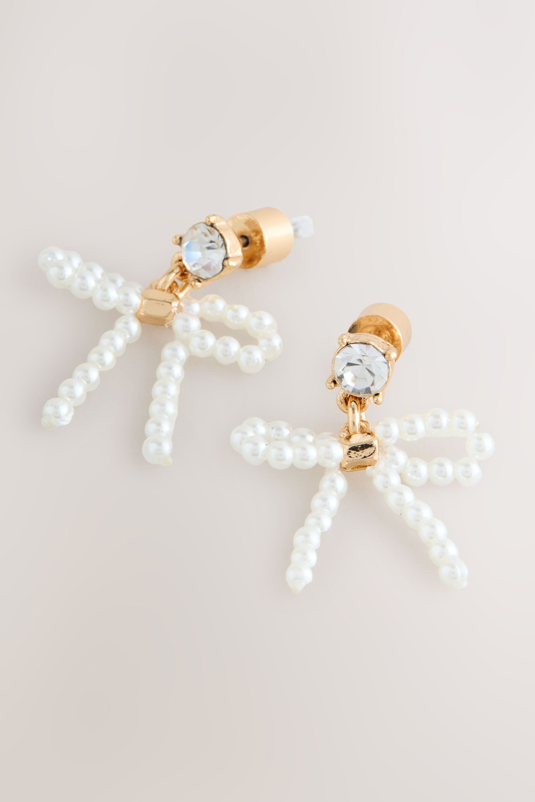 Next Paar Ohrstecker Ohrstecker in Schleifenform in Perlenoptik (1-tlg) günstig online kaufen