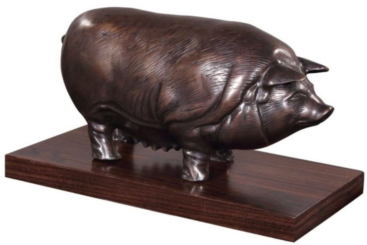 Casa Padrino Dekofigur Luxus Bronzefigur Schwein auf Holzsockel Bronze / Dunkelbraun 35 x 17 x H. 19 cm - Deko Figur