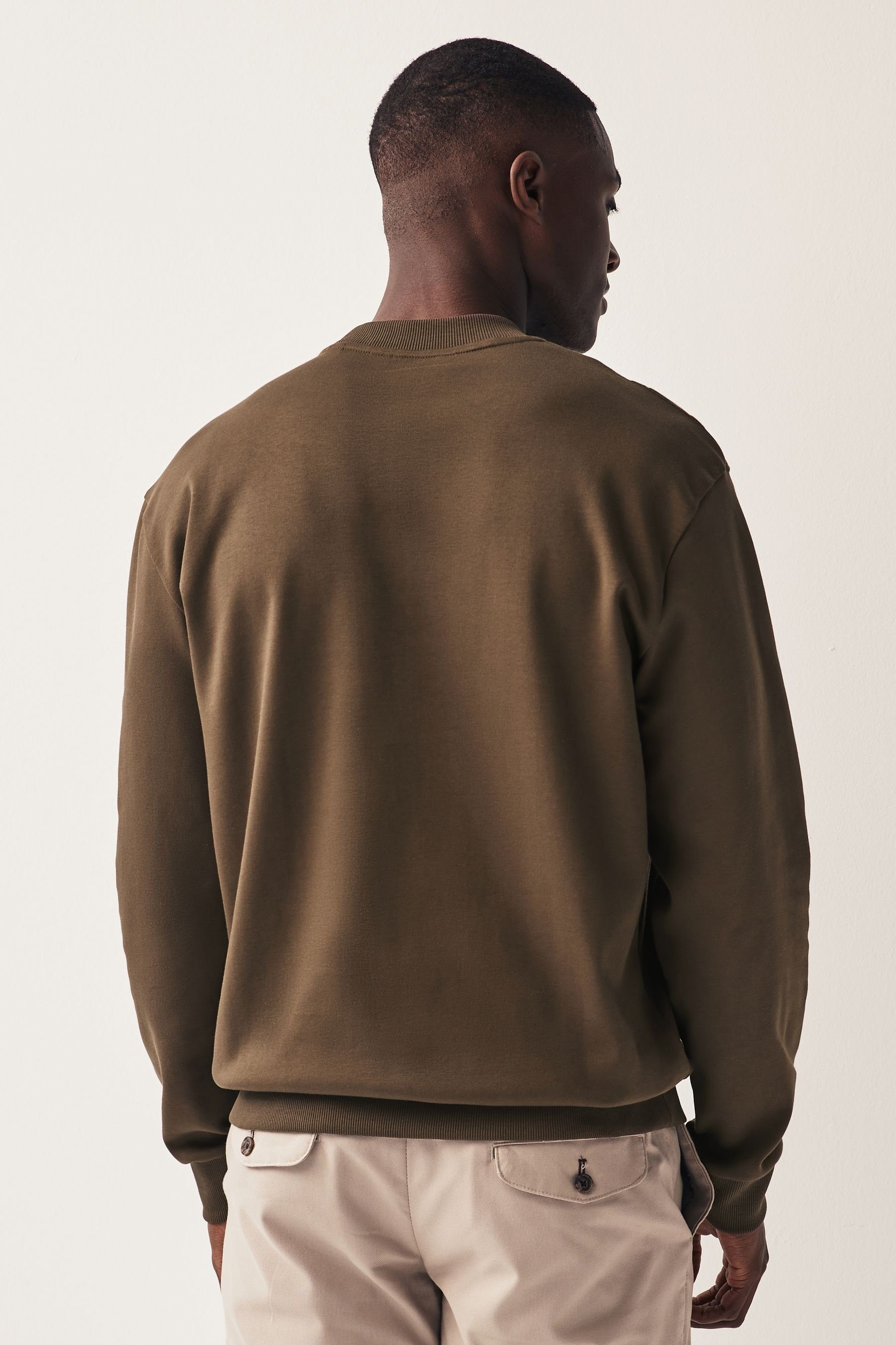 Brown Strukturiertes Rundhalsausschnitt Langarmshirt Next (1-tlg) mit Shirt