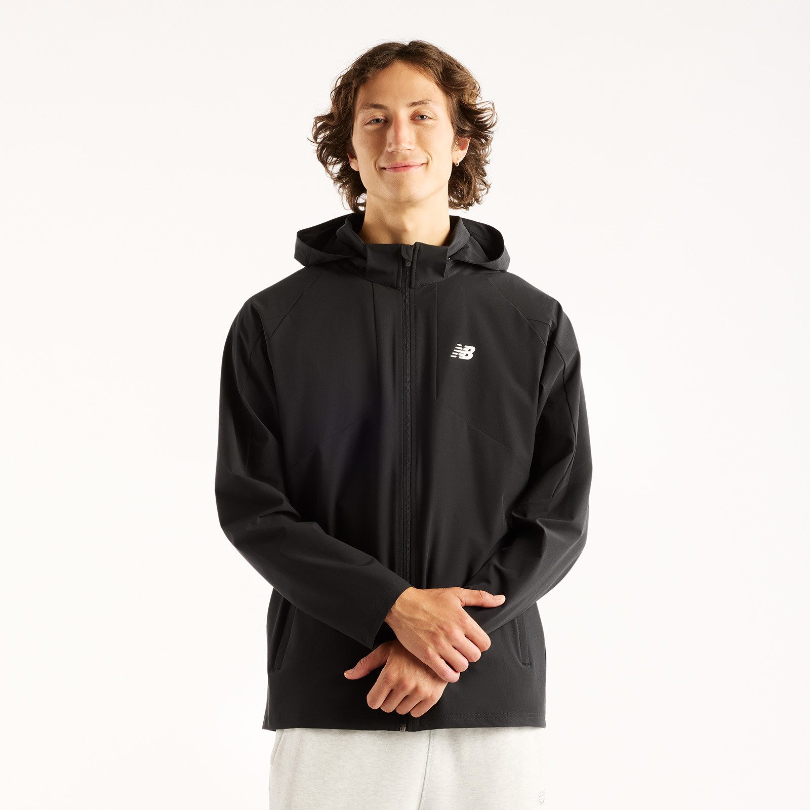 New Balance Trainingsjacke UTILITY STRETCH WOVEN JACKET Trainingsjacke für Fitness und sportliche Aktivitäten