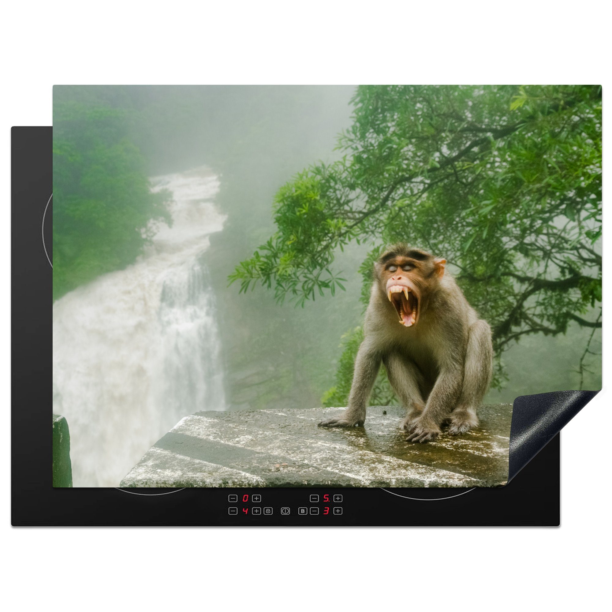 MuchoWow Herdblende-/Abdeckplatte Schreiender Affe vor Wasserfall, Vinyl, (1 tlg), 70x52 cm, Mobile Arbeitsfläche nutzbar, Ceranfeldabdeckung
