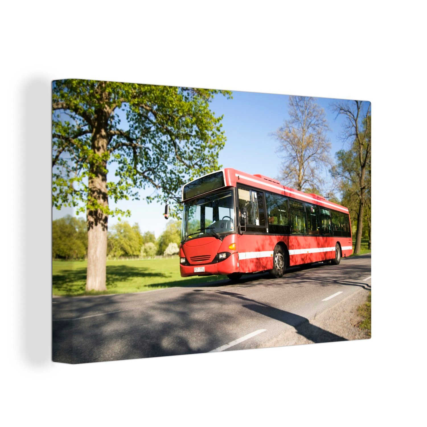 OneMillionCanvasses® Leinwandbild Eine Seitenansicht eines fahrenden Busses, (1 St), Wandbild Leinwandbilder, Aufhängefertig, Wanddeko, 30x20 cm