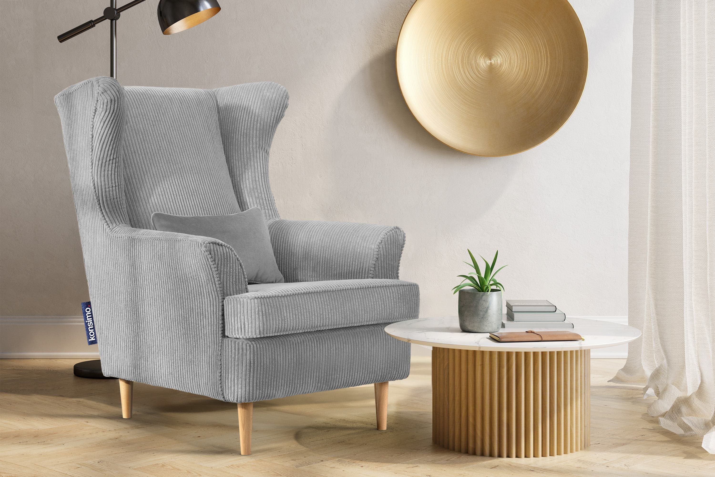 Konsimo Ohrensessel STRALIS Sessel, zeitloses dekorativem Füße, inklusive hohe Design, Kissen