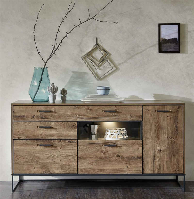 möbelando Sideboard Manhattan, Modernes Sideboard mit 1 Klappe, 1 Holztür, 2 Schubkästen, 1 Schubkasten mit Doppelzarge, 1 höhenverstellbaren Einlegeboden und 1 Glasfach, Korpus aus Spanplatte (außen: Haveleiche Cognac Nachbildung, innen: graphit), Front aus MDF in Haveleiche Cognac mit Klarglaseinsatz, Gestell aus Metall in Graphit, Griffe aus Aluminium in Anthrazitgrau gepulvert, Schubkästen mit Selbsteinzug und Softclose-Funktion, Türstopper mit Softclose, Hängebeschläge inklusive