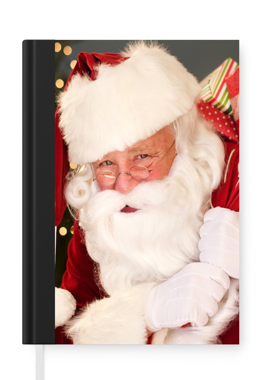 MuchoWow Notizbuch Ein Porträt des Weihnachtsmanns, der einen roten Sack über der, Journal, Merkzettel, Tagebuch, Notizheft, A5, 98 Seiten, Haushaltsbuch