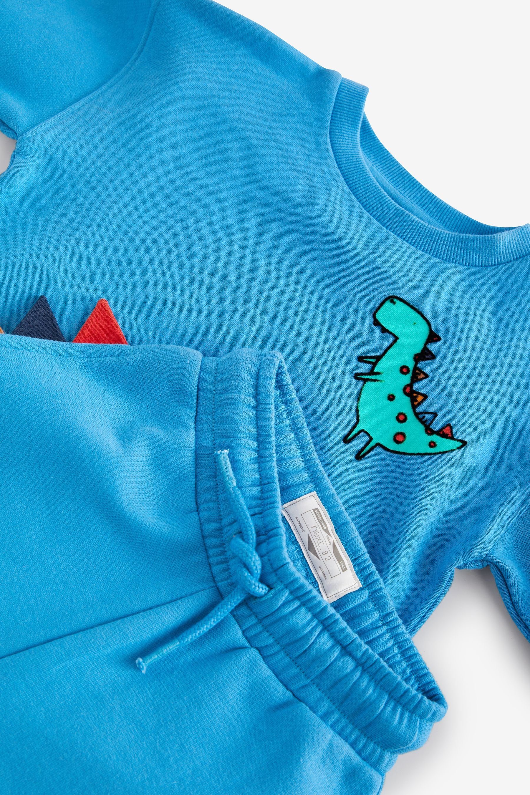 (2-tlg) im Jogginghose Sweatanzug Motiv Next Dinosaur Blue Set Sweatshirt und mit