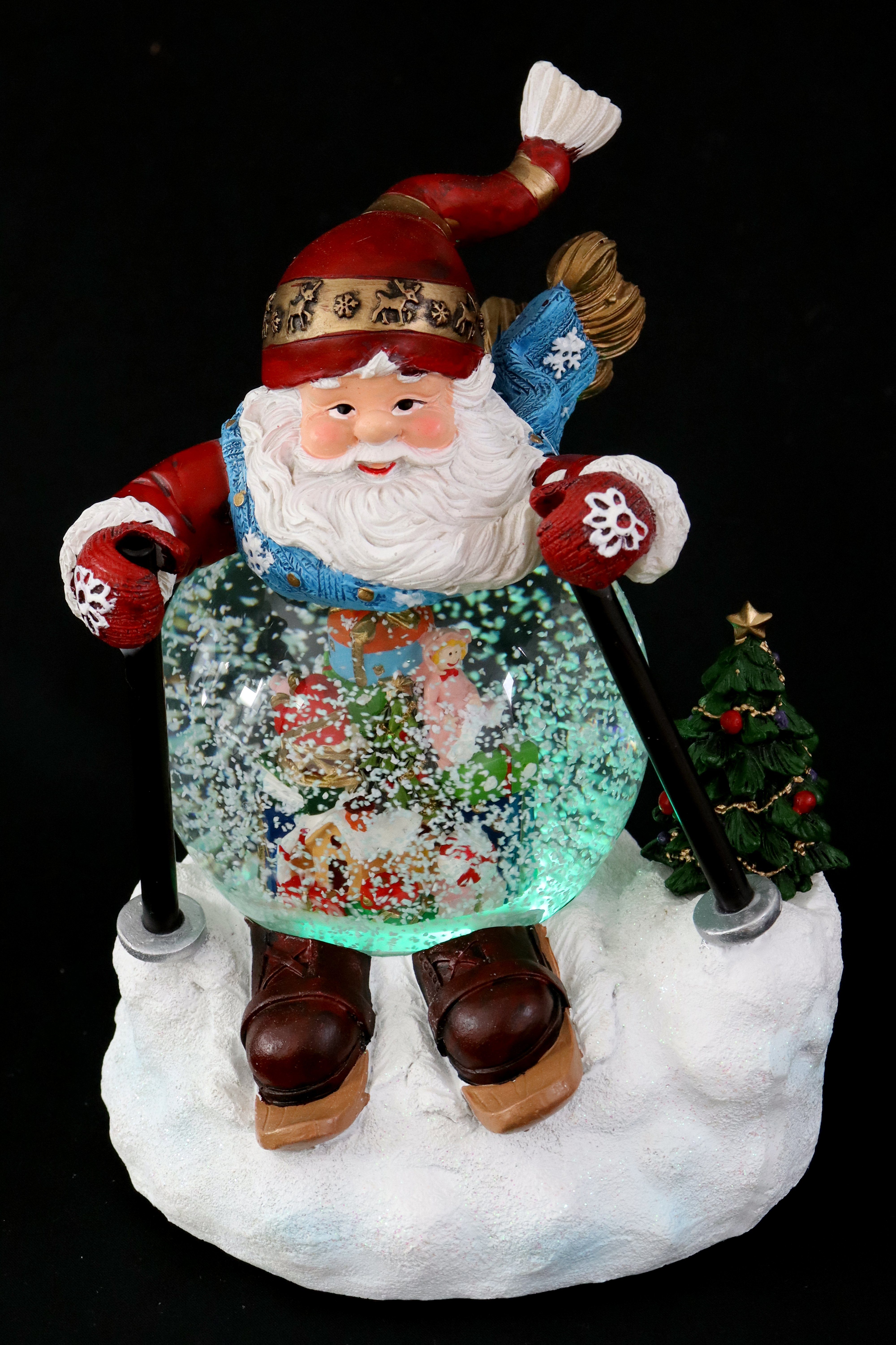 Schneekugel & Licht Ø100mm als ELLUG mit Schneewirbel, H.: Skifahrer-Weihnachtsmann Musik Schneekugel 21cm