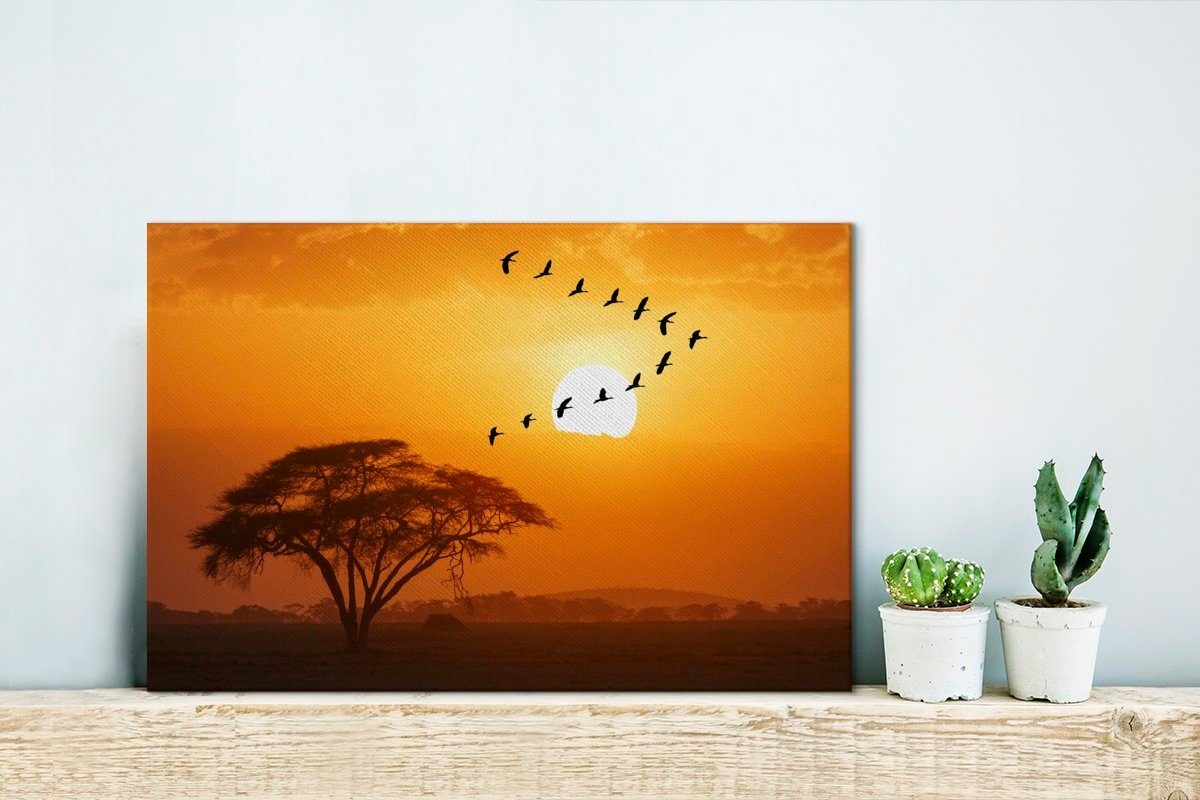Ein Wanddeko, Nilgänse 30x20 fliegt bei Sonnenuntergang Wandbild (1 OneMillionCanvasses® in in, Leinwandbild St), Aufhängefertig, Schwarm cm Leinwandbilder, V-Formation