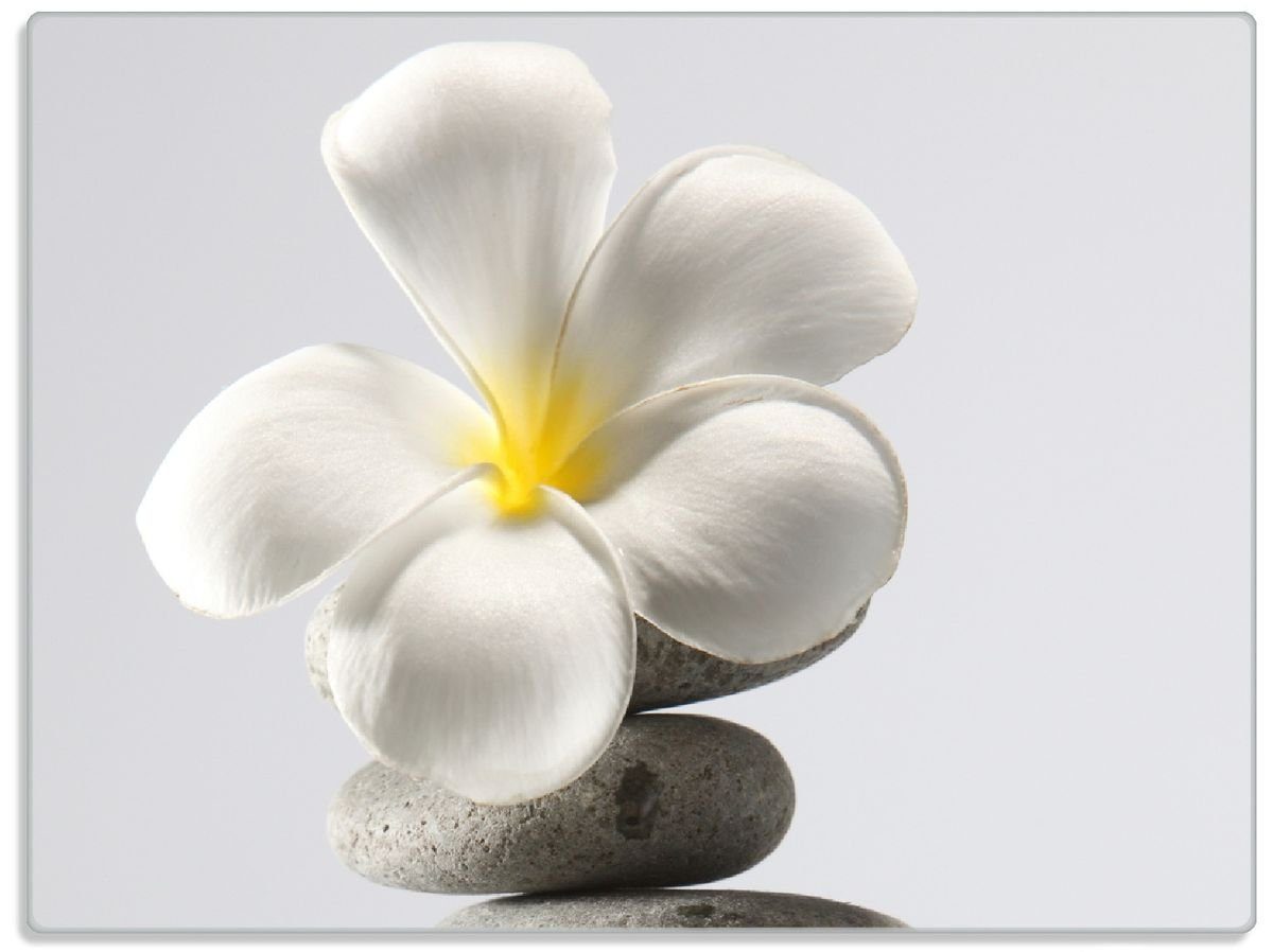 Wallario Schneidebrett Blume auf gestapelten Steinen, ESG-Sicherheitsglas, (inkl. rutschfester Gummifüße 4mm, 1-St), 30x40cm