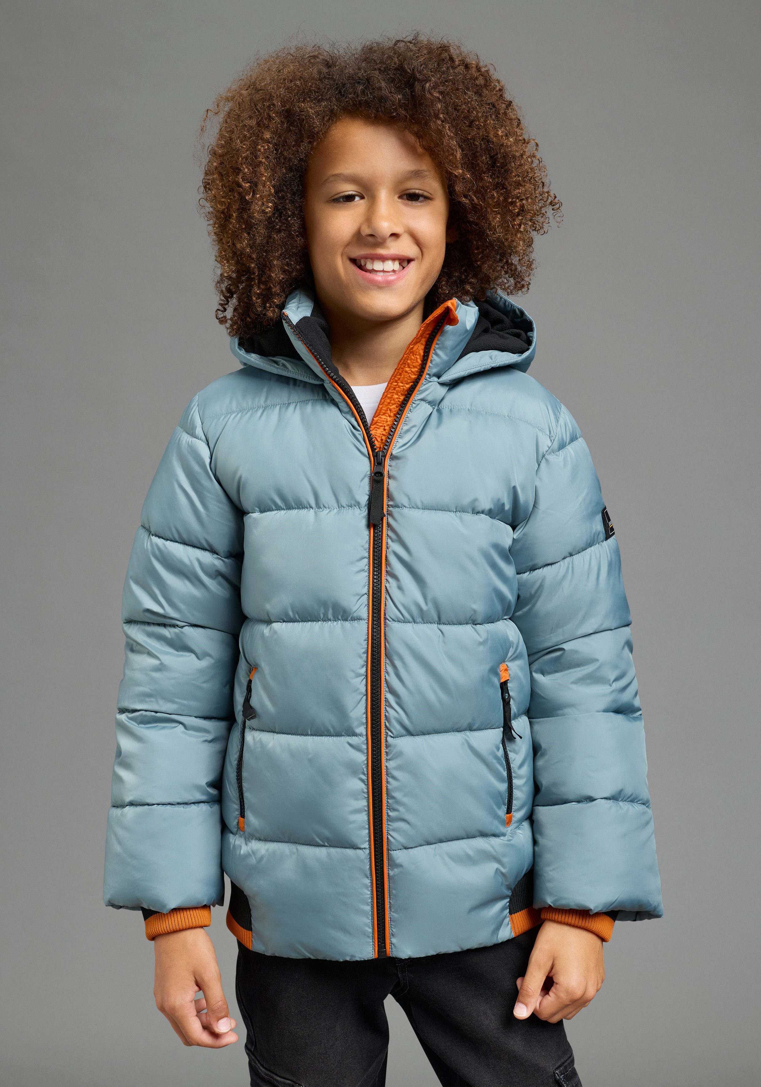 Bruno Banani Outdoorjacke BRUNO BANANI Steppjacke mit modischen Rib-Bündchen Warme Jacke mit Kapuze, Fleecefutter, windabweisend, wasserabweisend