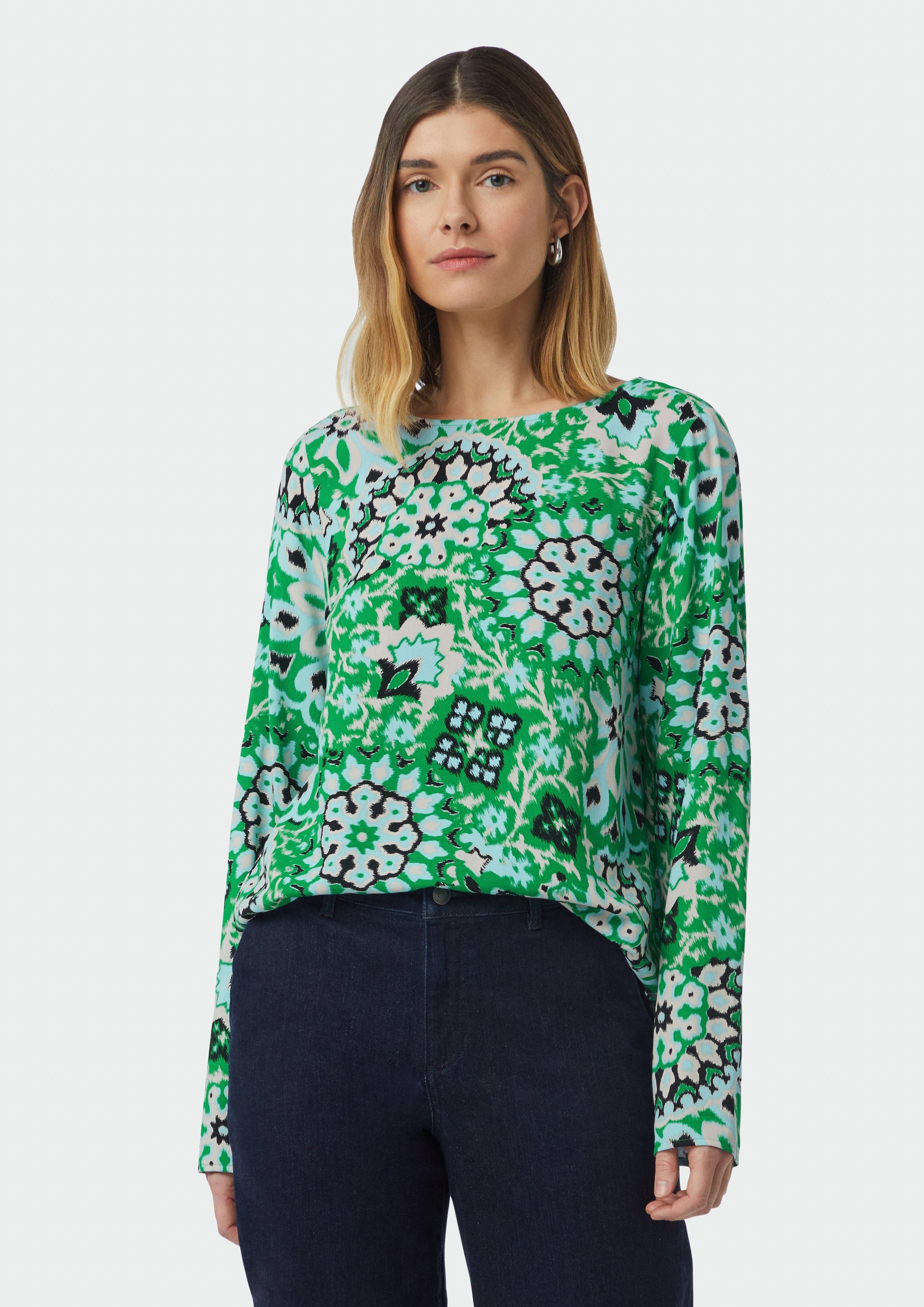 Langarmbluse Bluse mit seitlich geschlitztem Saum und All-over-Print