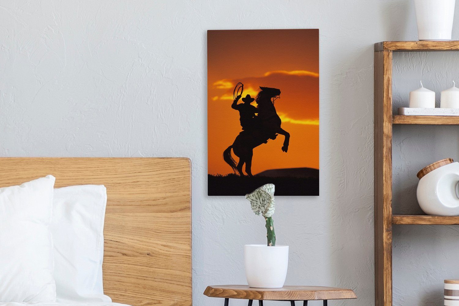 OneMillionCanvasses® Leinwandbild Leinwandbild fertig auf inkl. bespannt Zackenaufhänger, Silhouette eines Cowboys cm der 20x30 Pferderücken, St), tänzelt, (1 Gemälde, dem
