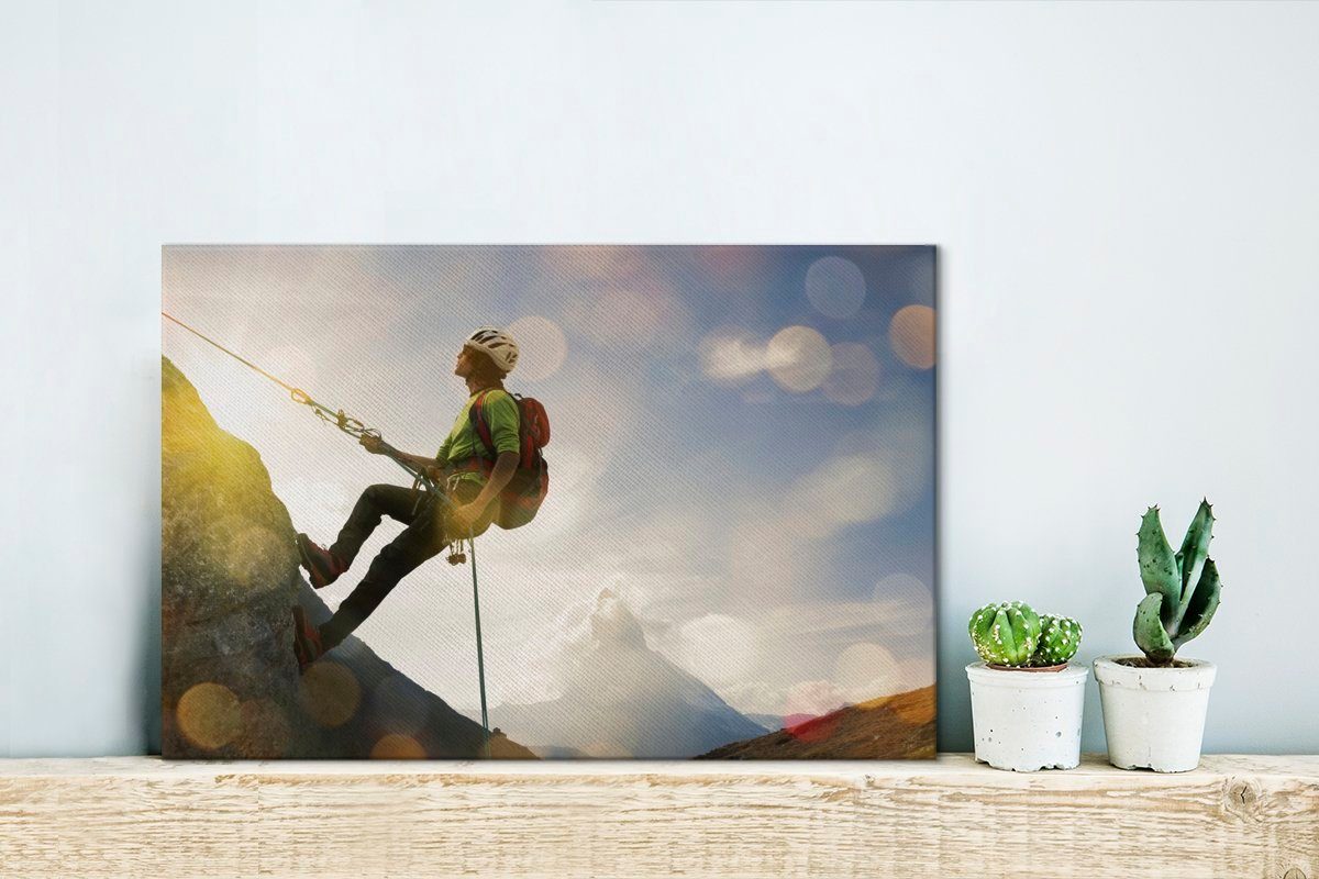 OneMillionCanvasses® Leinwandbild Bergsteiger 30x20 Aufhängefertig, St), Wandbild Leinwandbilder, cm Wanddeko, steile Bergwand, (1 besteigt
