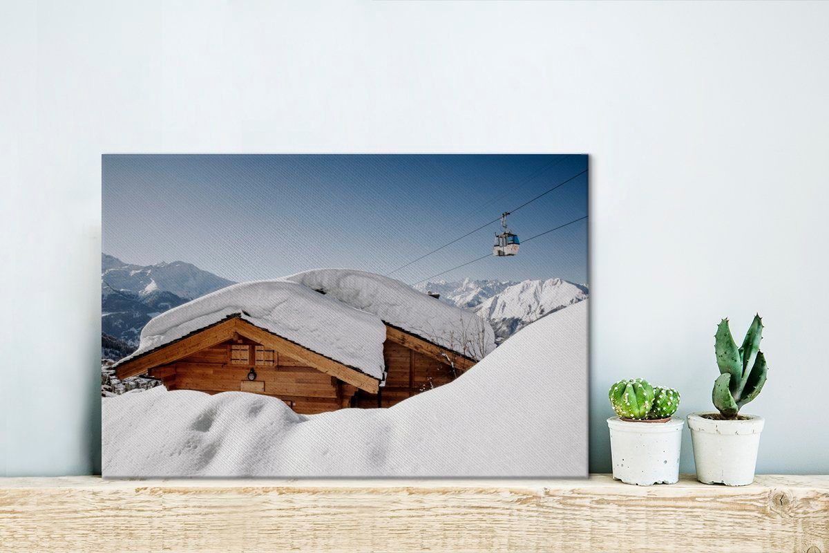 OneMillionCanvasses® Leinwandbild Wandbild 30x20 Aufhängefertig, Wanddeko, Hütte in Schnee Schweiz, Leinwandbilder, der auf cm einer St), (1
