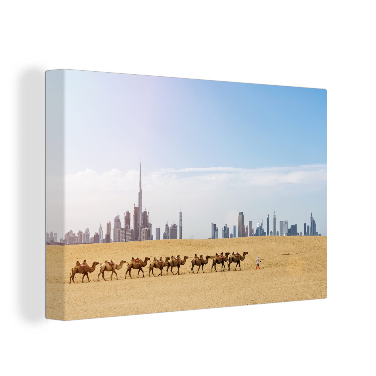 OneMillionCanvasses® Leinwandbild Kamelherde in der Wüste und der Burj Khalifa und Dubai im Hintergrund, (1 St), Wandbild Leinwandbilder, Aufhängefertig, Wanddeko, 30x20 cm