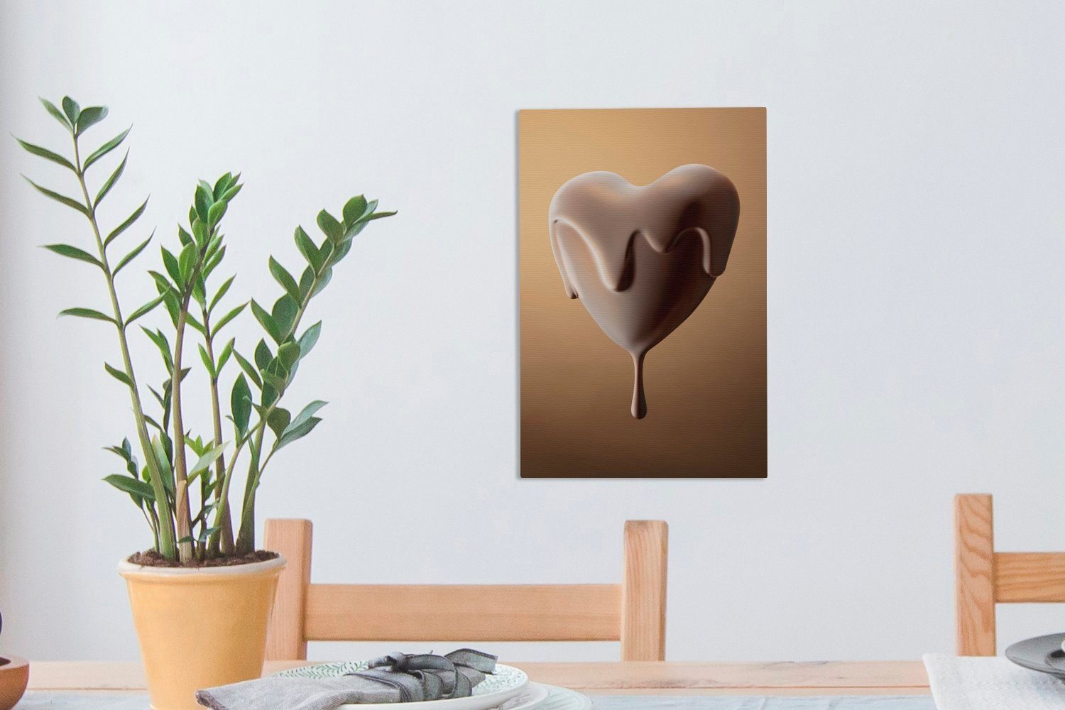 OneMillionCanvasses® Leinwandbild Ein 20x30 bespannt Gemälde, überzogenes herzförmiges, Bonbon, (1 Zackenaufhänger, inkl. fertig cm mit Schokolade St), Leinwandbild