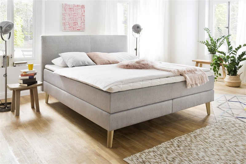 möbelando Boxspringbett Greta, Boxspringbett Greta mit Stoffbezug Porto hellgrau, Liegefläche 180x200 cm, Kopfteil glatt, Holzfuß eichefarbig