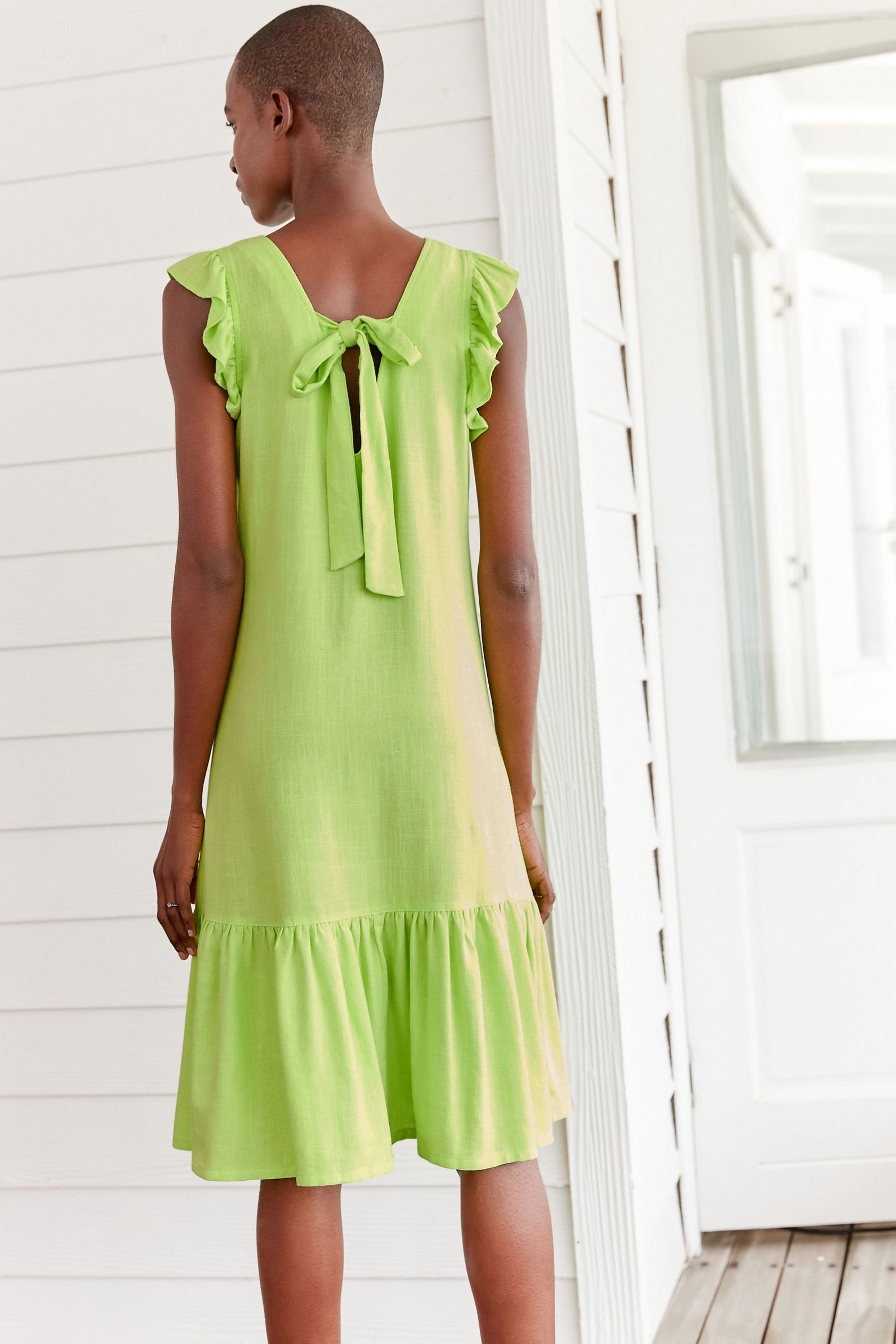 Next Minikleid Minikleid mit Rückenschleife Green (1-tlg) Lime und Rüschenärmeln