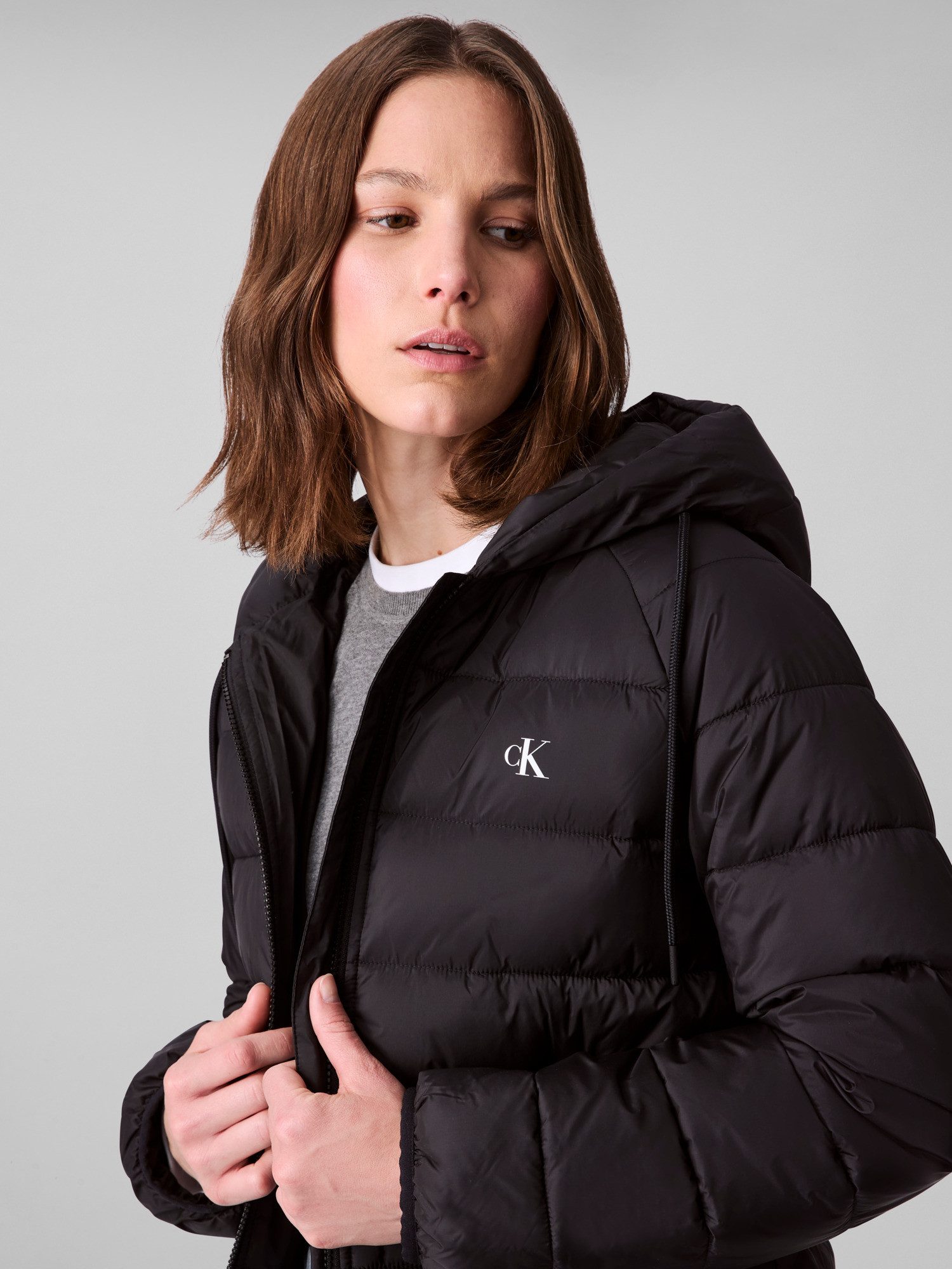 Calvin Klein Jeans Steppjacke LIGHTWEIGHT LOGO PUFFER Mit Logo an der Kaput günstig online kaufen
