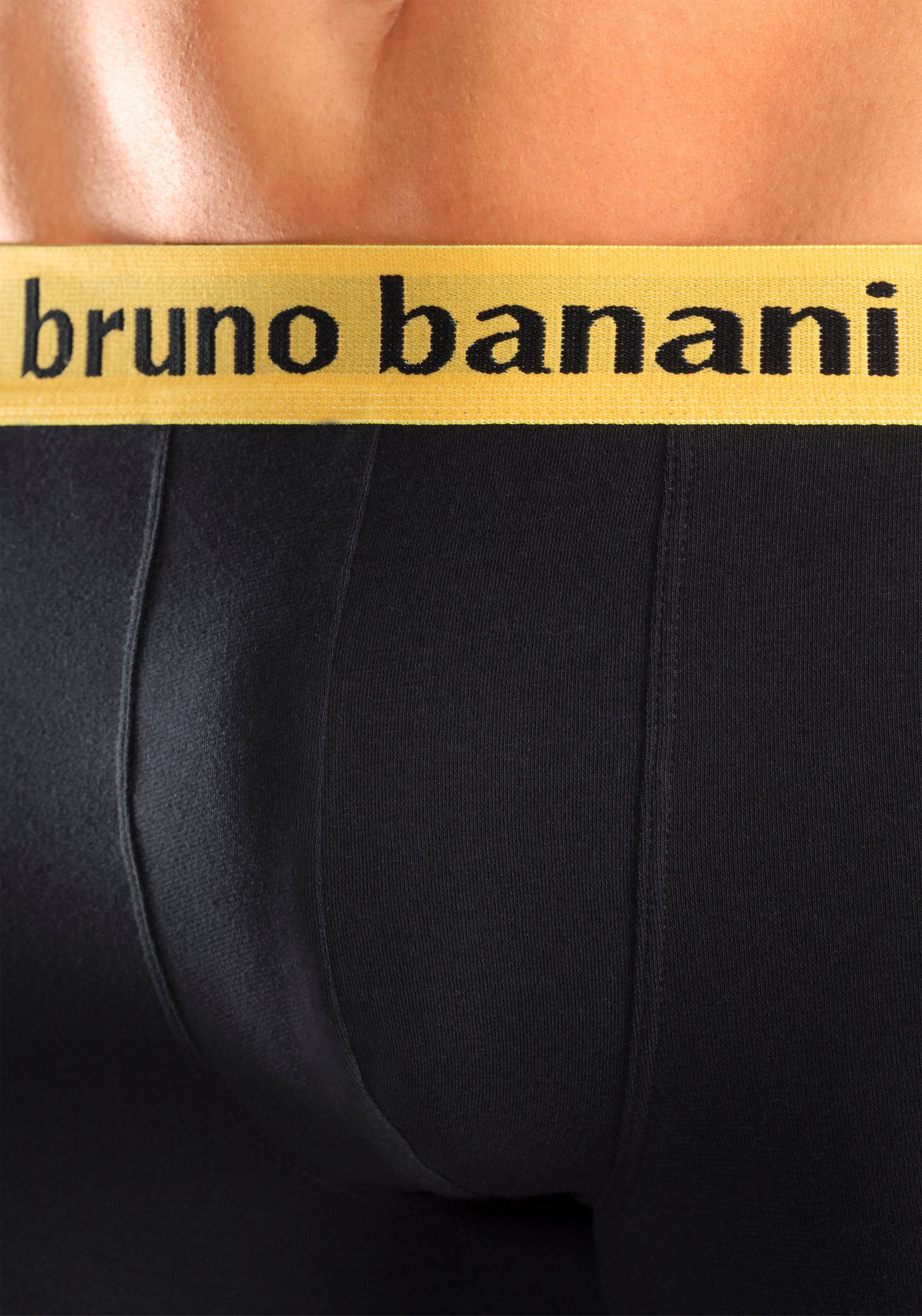 Boxer 4-St) schwarz-orange, Bruno Banani schwarz-gelb, schwarz-türkis, am Bündchen farbigen mit Marken-Schriftzug (Packung, schwarz-lila