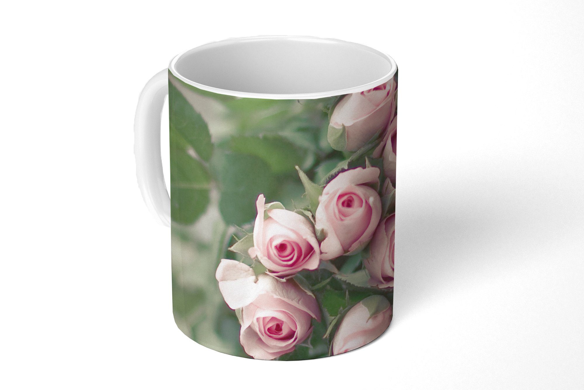 MuchoWow Tasse Ein großes Buch mit rosa Rosen liegt auf einem Tisch., Keramik, Kaffeetassen, Teetasse, Becher, Teetasse, Geschenk