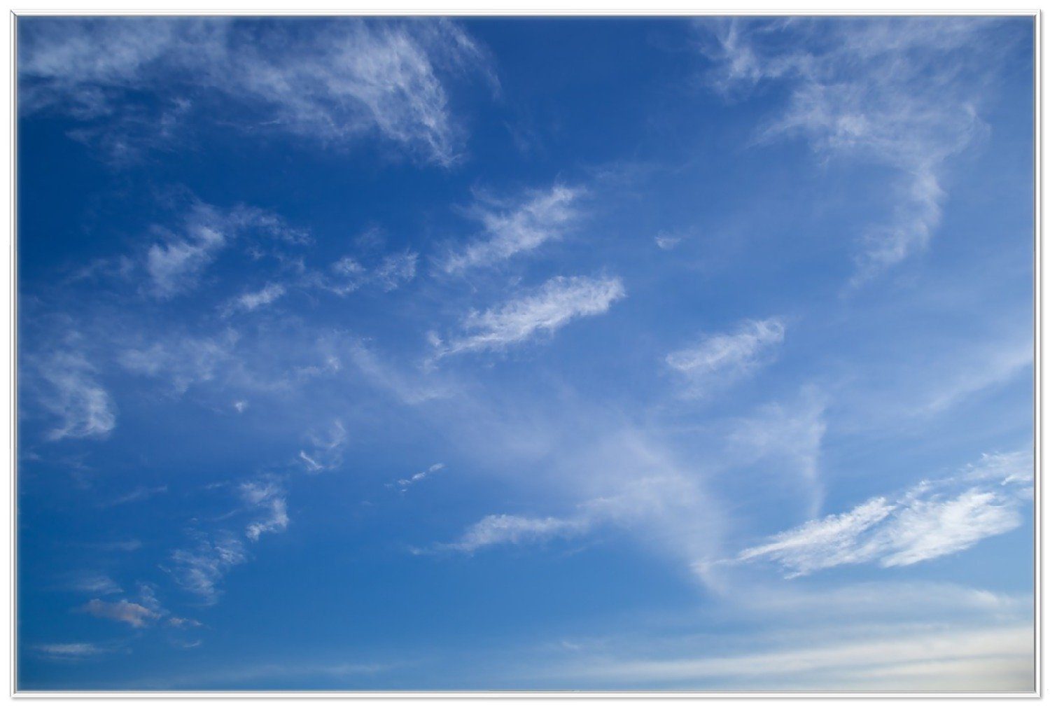 Wallario Poster, Blauer Himmel mit vereinzelten günstig online kaufen