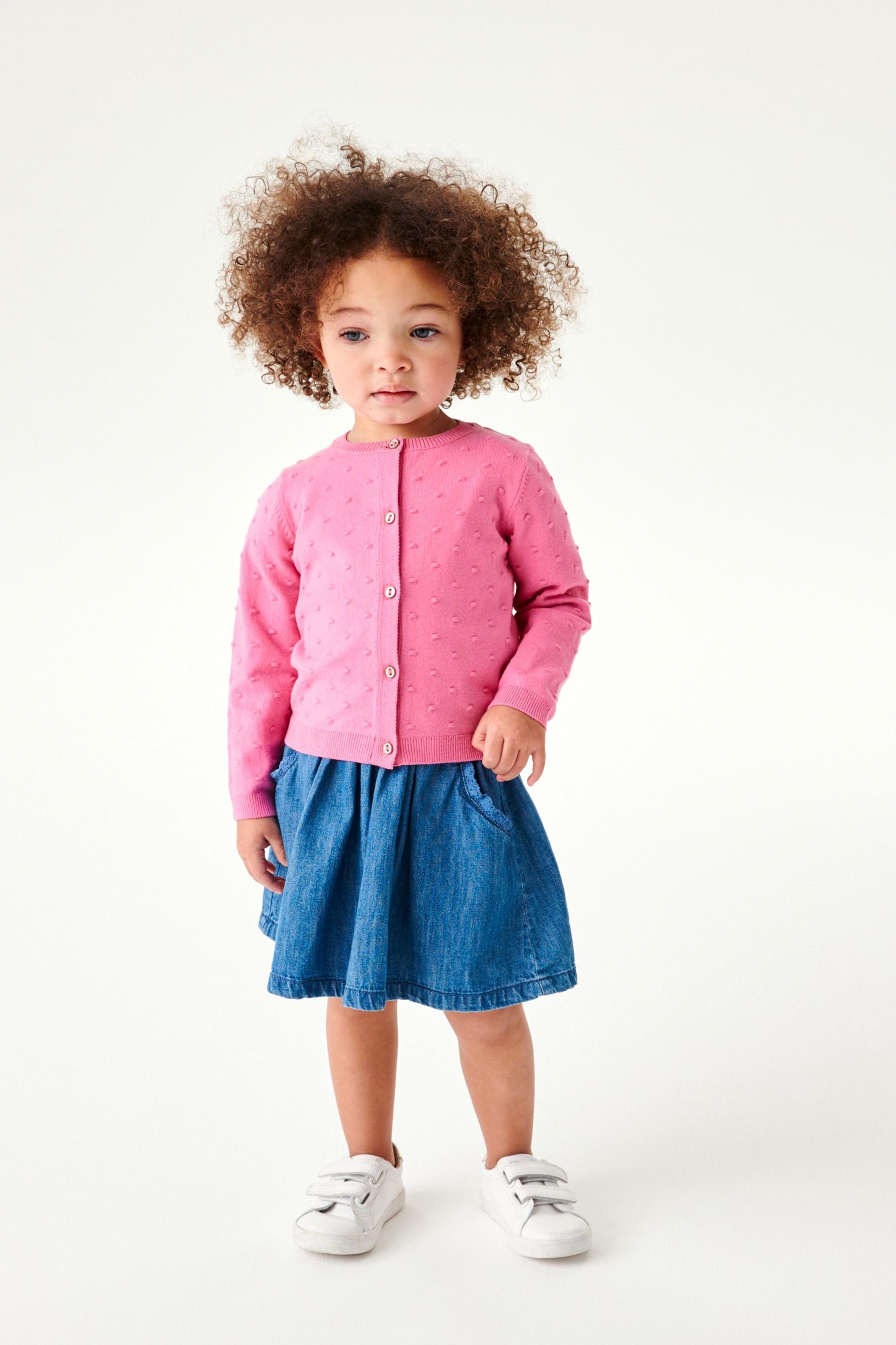 (1-tlg) Raspberry Strickjacke Bommeln Strickjacke mit Pink Next