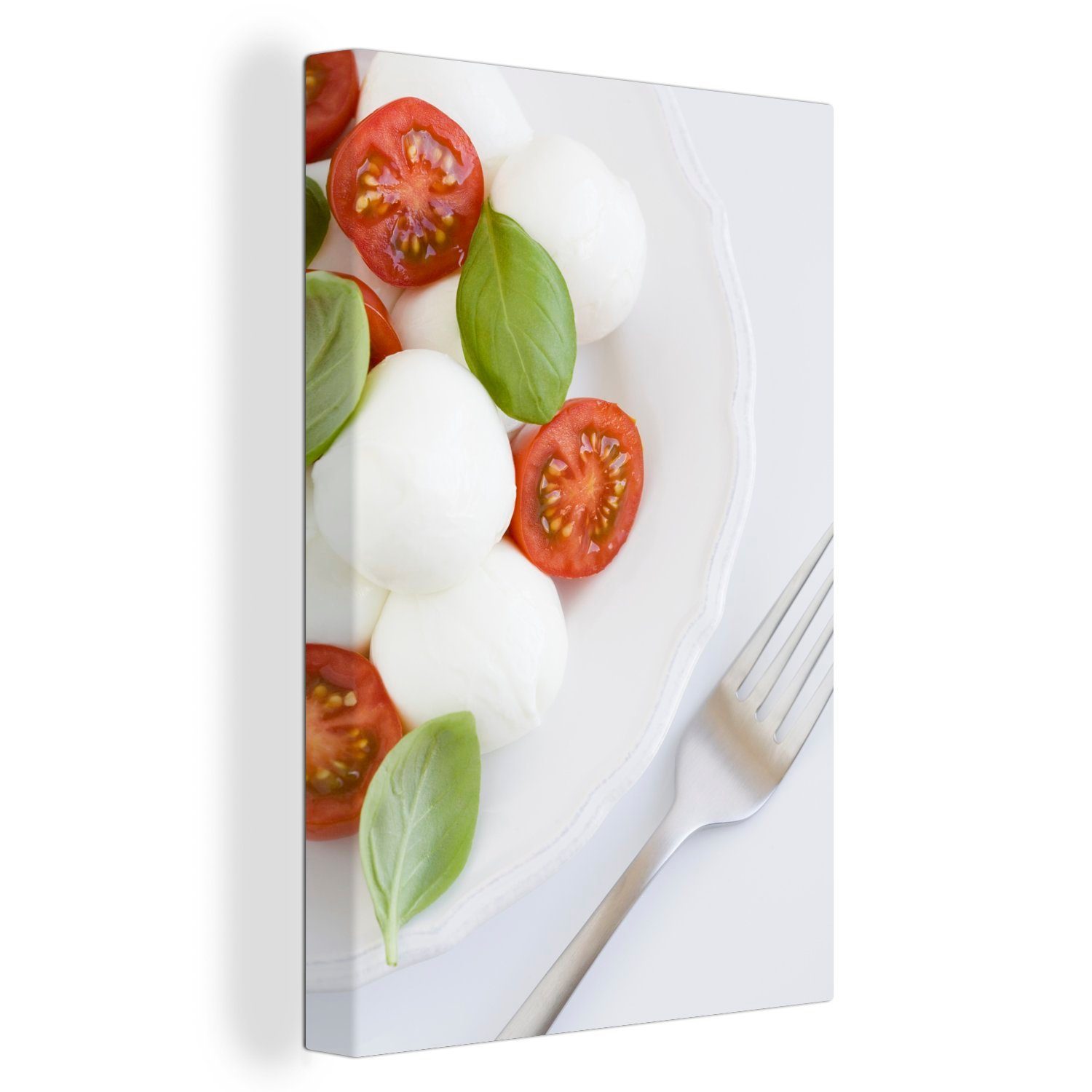OneMillionCanvasses® Leinwandbild Mozzarella mit Tomate und Basilikum auf einem Teller, (1 St), Leinwandbild fertig bespannt inkl. Zackenaufhänger, Gemälde, 20x30 cm