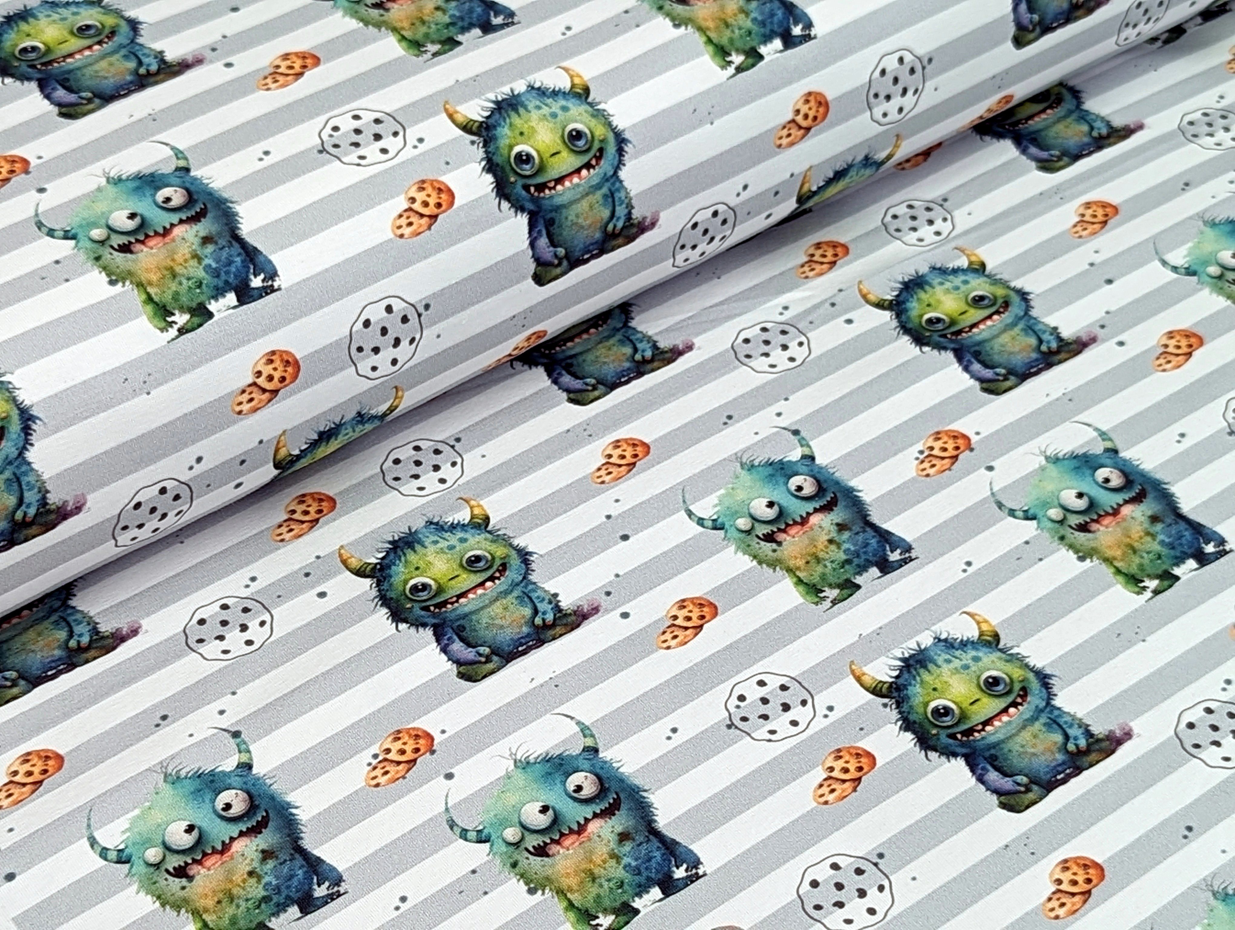 Corileo Stoff Eigenproduktion Baumwolljersey Kleines Keks Monster auf Streifen