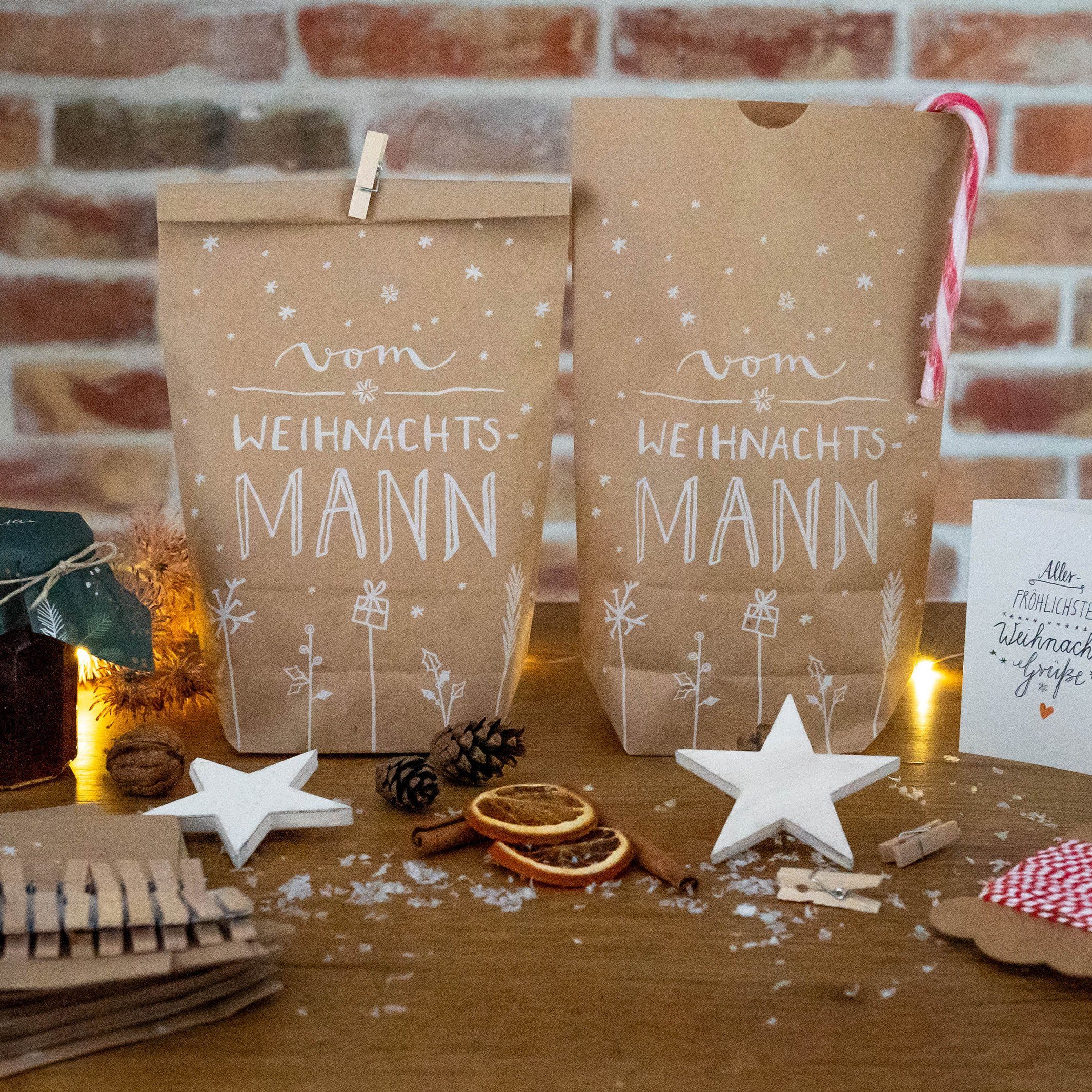 Eine der Guten Verlag Geschenkpapier 24 Weihnachtstüten - vom Weihnachtsmann - mit 24 Miniklammern