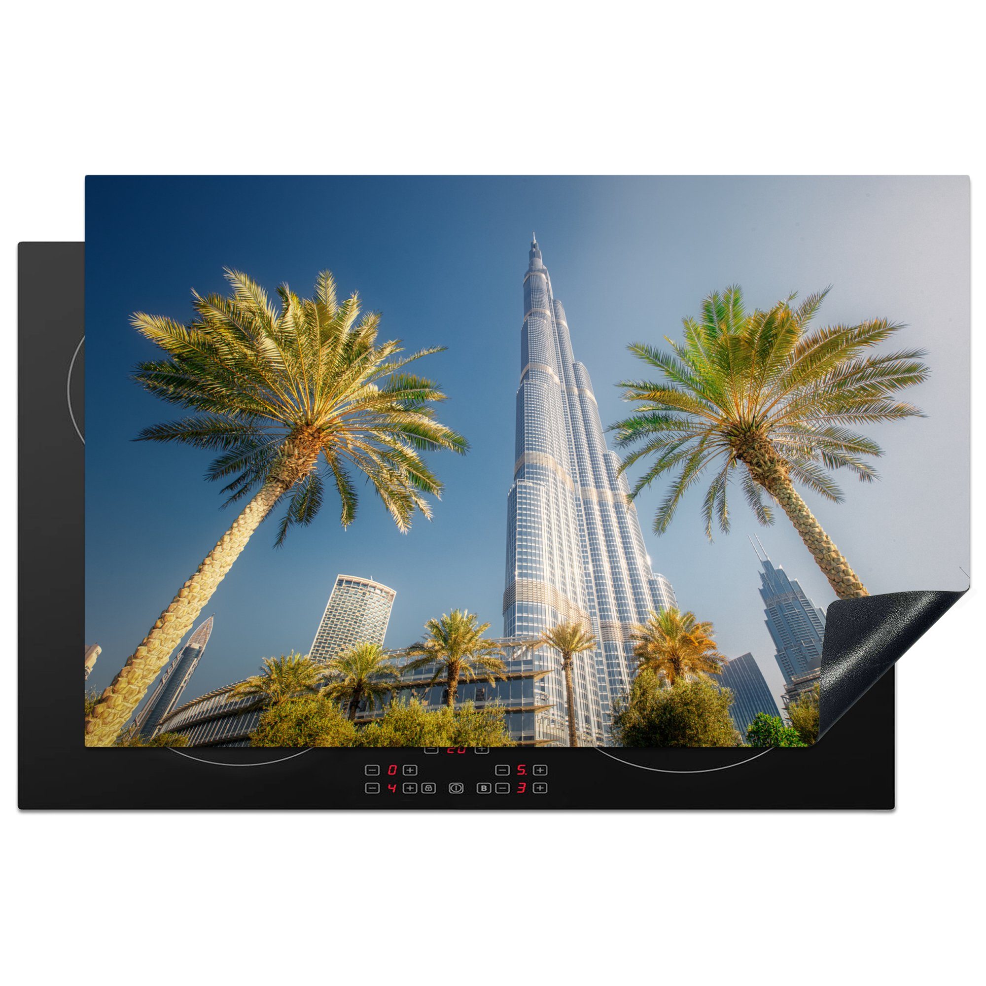 MuchoWow Herdblende-/Abdeckplatte Burj Khalifa in Dubai mit zwei Palmen, Vinyl, (1 tlg), 81x52 cm, Induktionskochfeld Schutz für die küche, Ceranfeldabdeckung