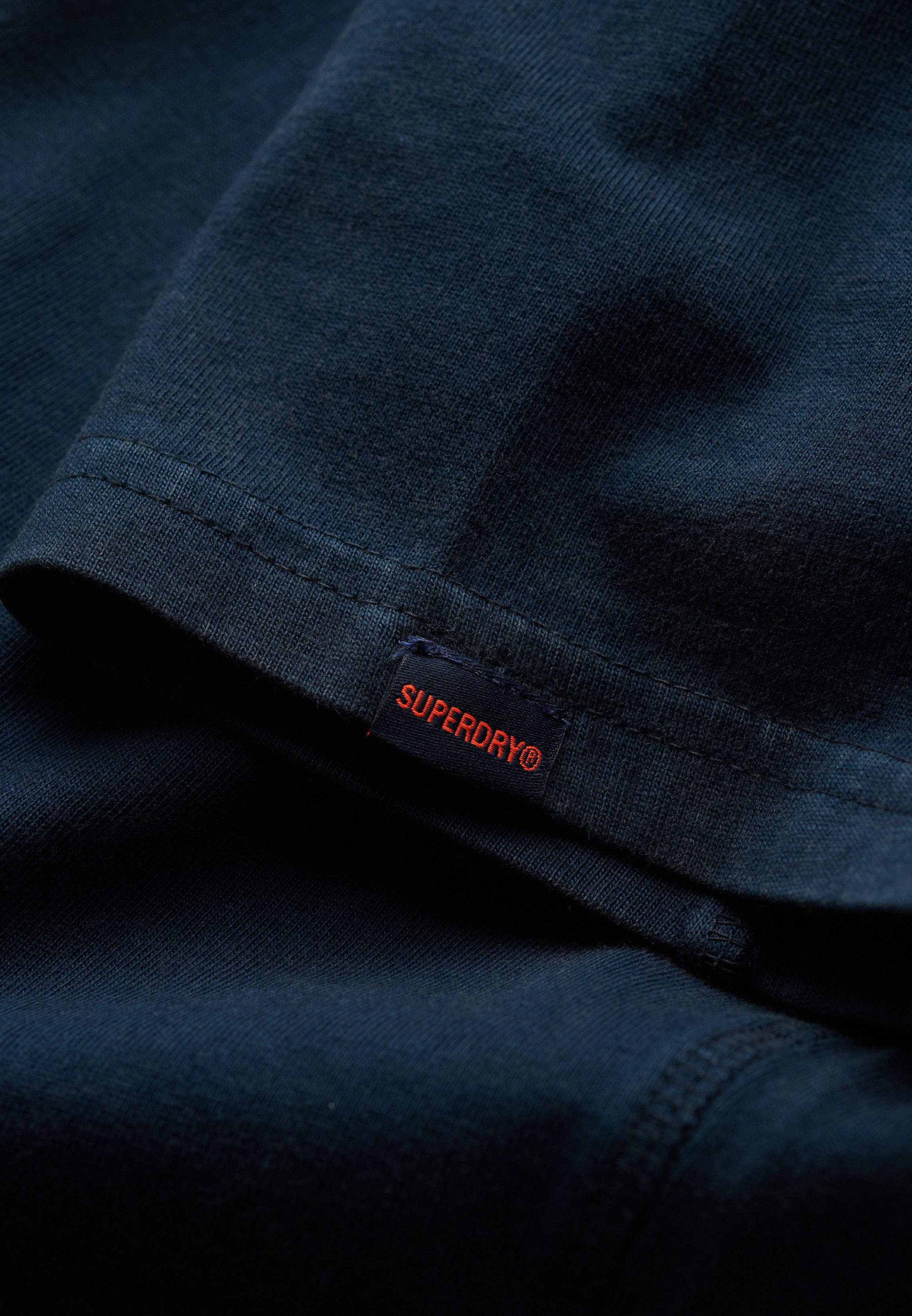 Superdry Poloshirt ESSENTIAL JERSEY POLO mit unifarbenem Design, aus Baumwolle und Single Jersey, Relaxed Fit