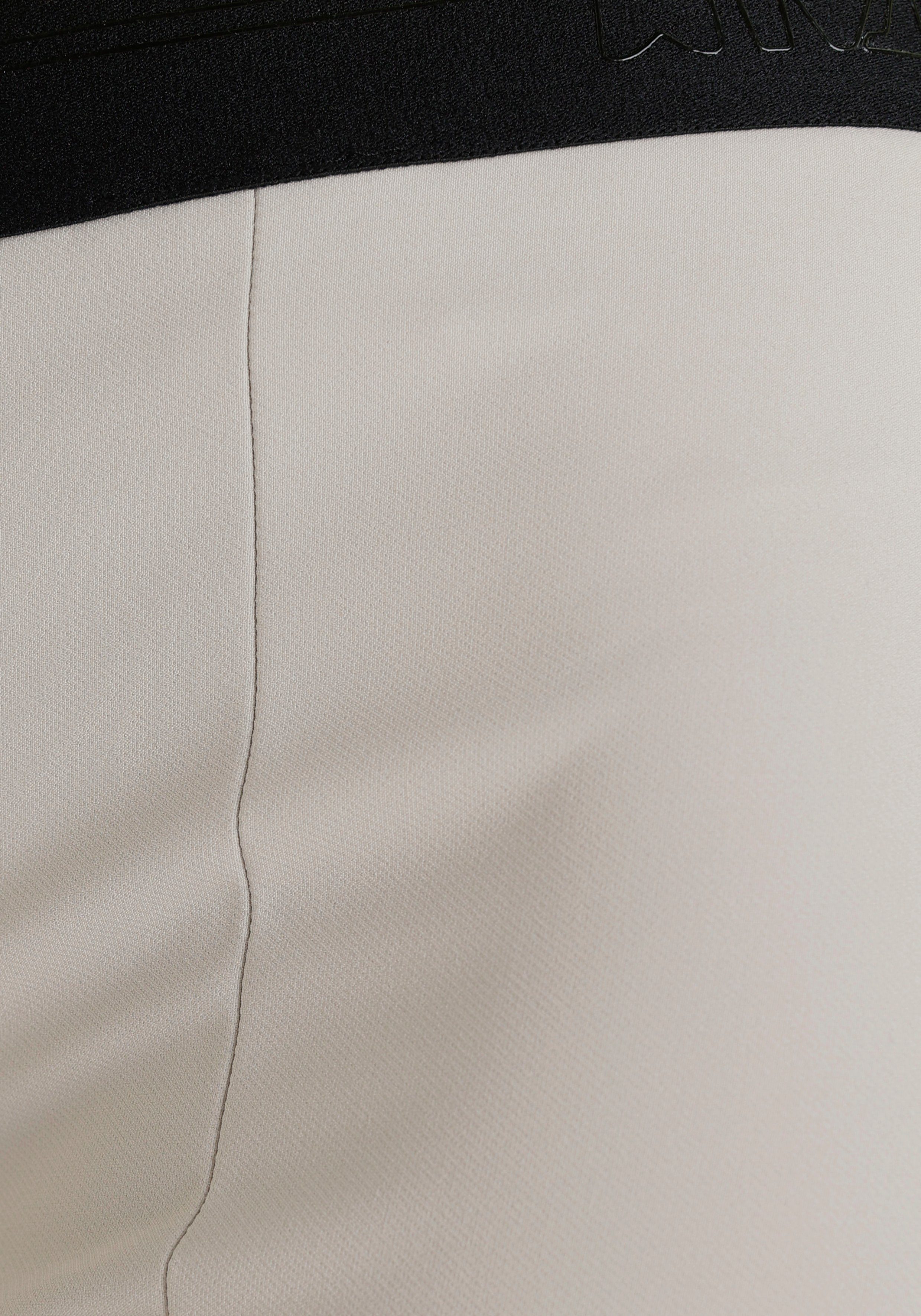 Kitzbühel vorne mit trendigen Sportalm Schlitz beige Anzughose