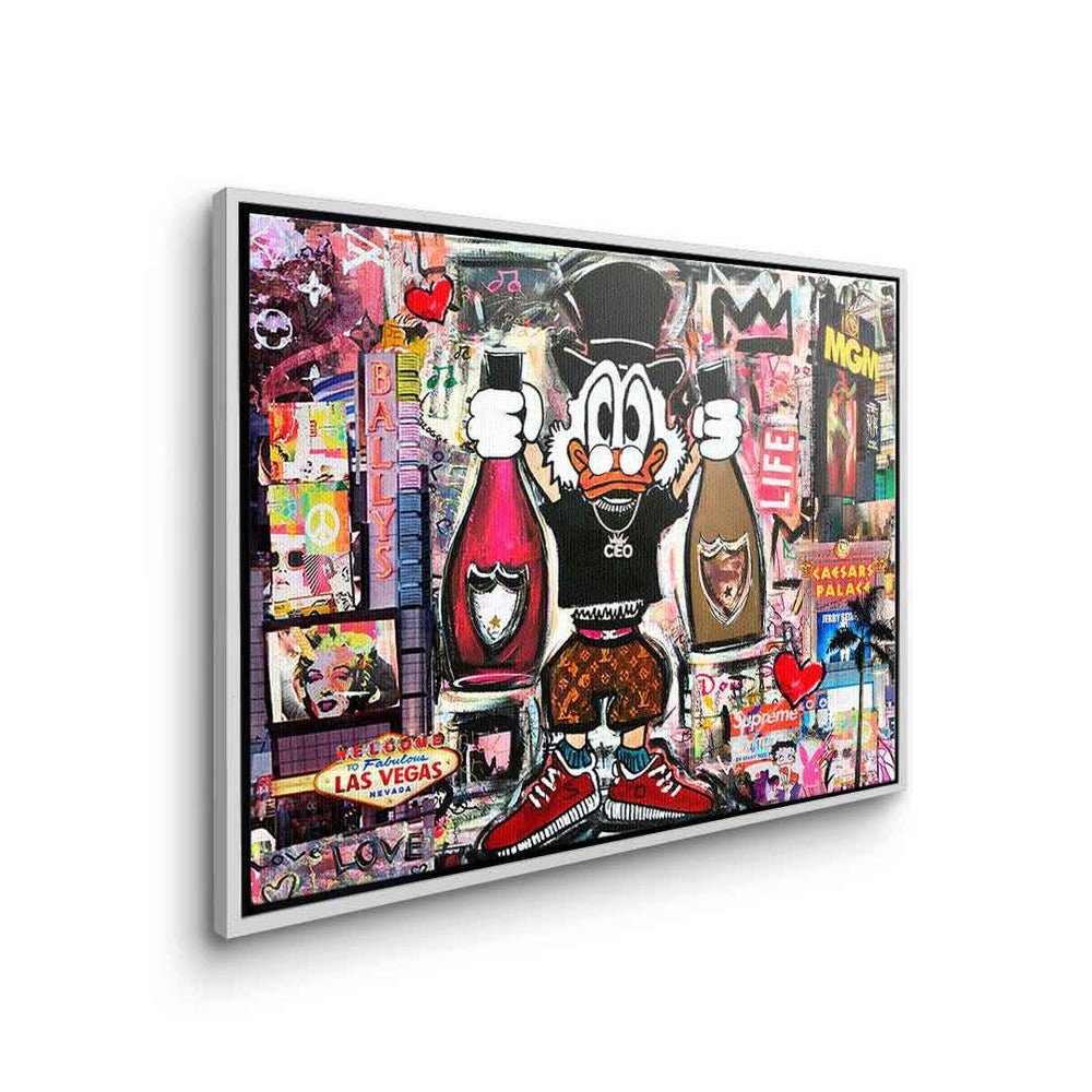 DOTCOMCANVAS® Leinwandbild Dagobert in Las Leinwandbild Pop Vegas Art quer Vegas, weißer Collage Dagobert Duck Comic Rahmen Las