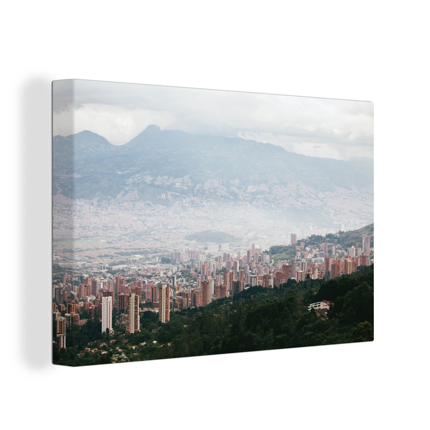 Leinwandbilder, Südamerika, Wandbild der OneMillionCanvasses® Aufhängefertig, Nebel 30x20 Leinwandbild cm Medellín über in Wanddeko, kolumbianischen St), (1 Stadt