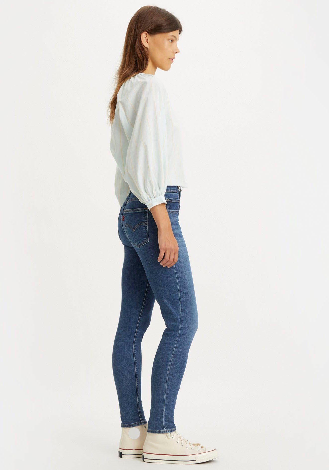 Levi's® in indigo rise High mit Bund 721 skinny blue mid hohem worn Skinny-fit-Jeans