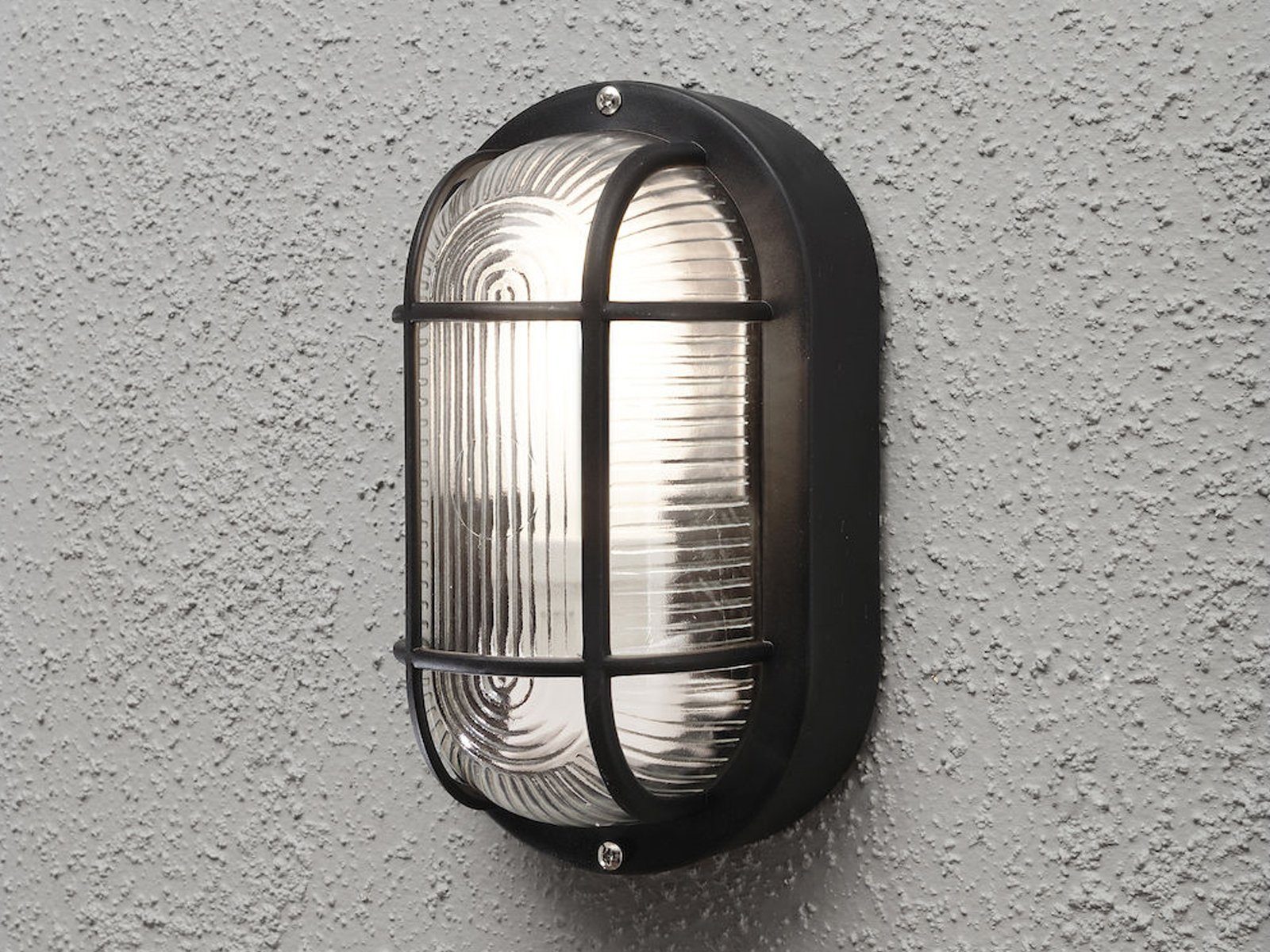 KONSTSMIDE LED Außen-Wandleuchte, LED wechselbar, Warmweiß, Klassische Feuchtraumleuchte aus Kunststoff & Acrylglas Schwarz H:20cm