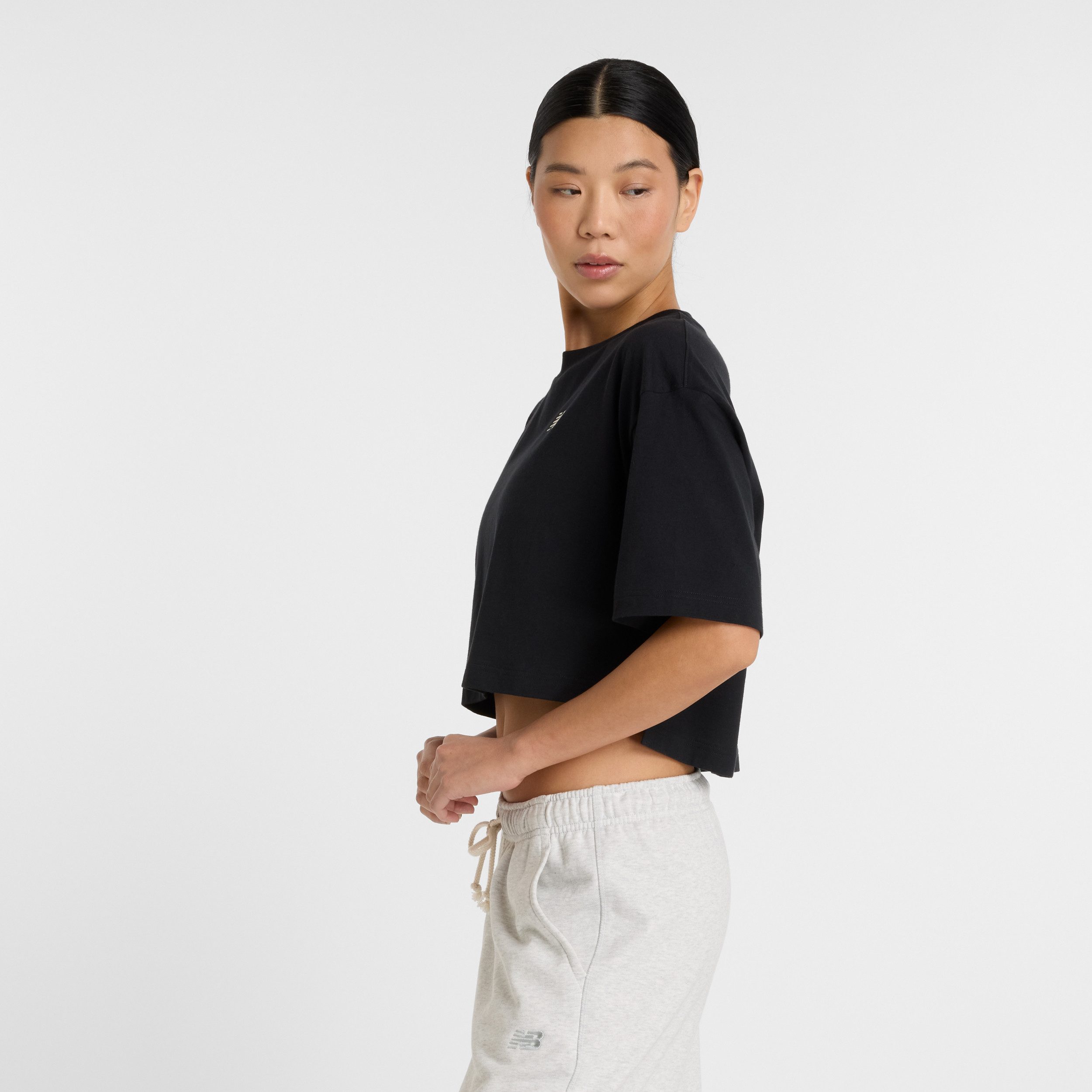 New Balance T-Shirt Reimagined Oversized Waist T-Shirt taillenbetonte Form, Oversized-Schnitt, aus Polyester und Elasthan