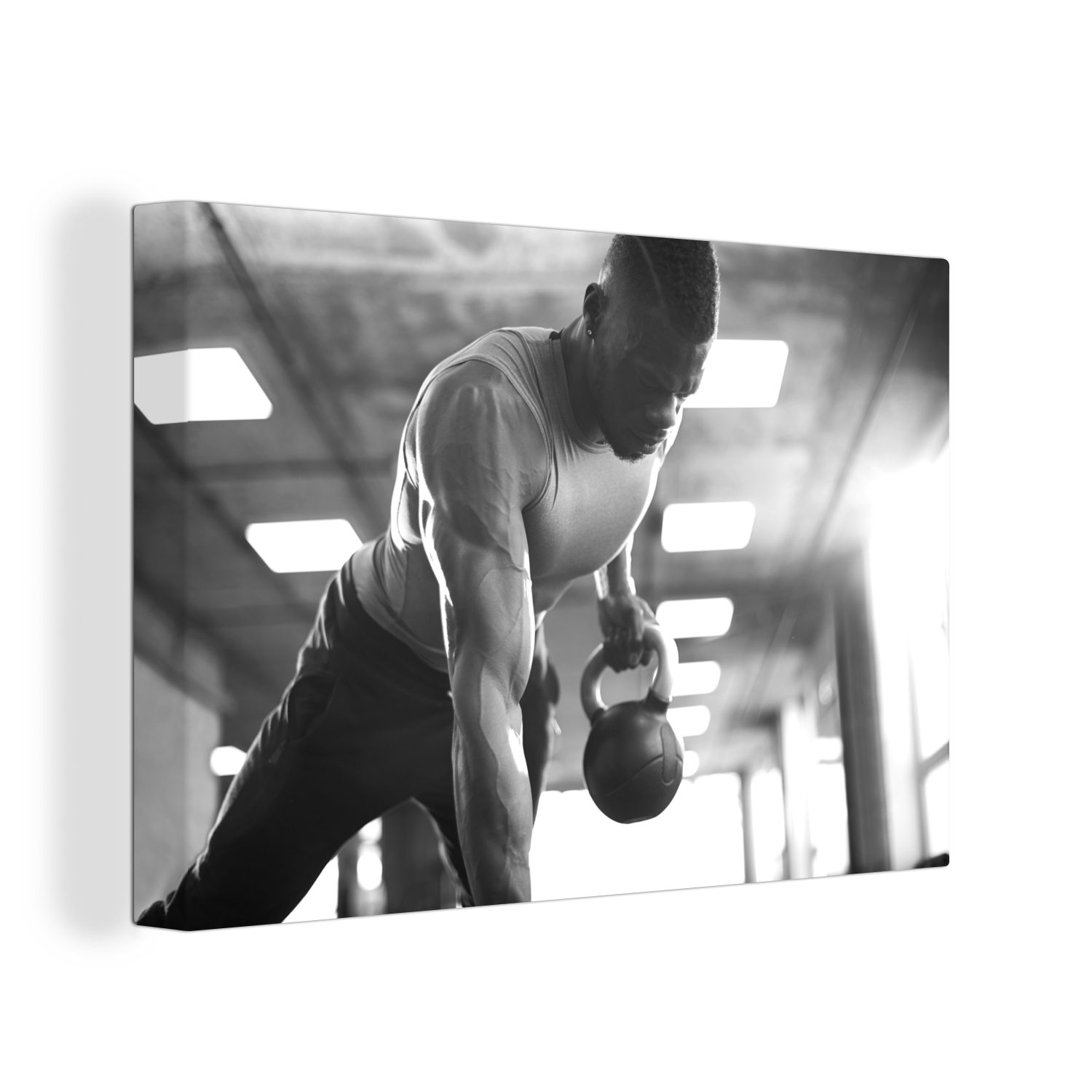 OneMillionCanvasses® Leinwandbild Ein starker Mann hebt Kettlebells beim Fitness - schwarz und weiß, (1 St), Wandbild Leinwandbilder, Aufhängefertig, Wanddeko, 30x20 cm
