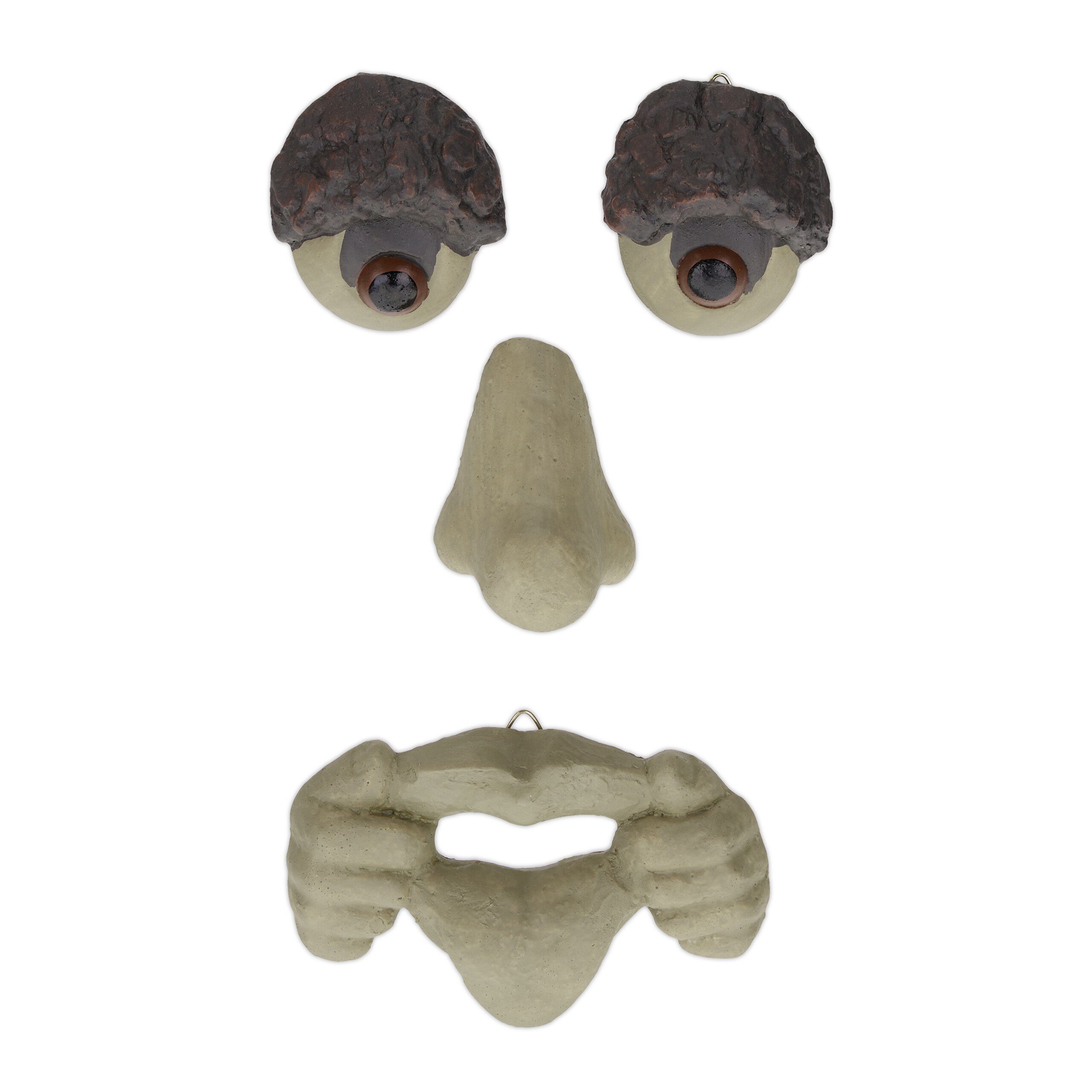Gartenfigur Baumgesicht mit rausgestreckter Zunge